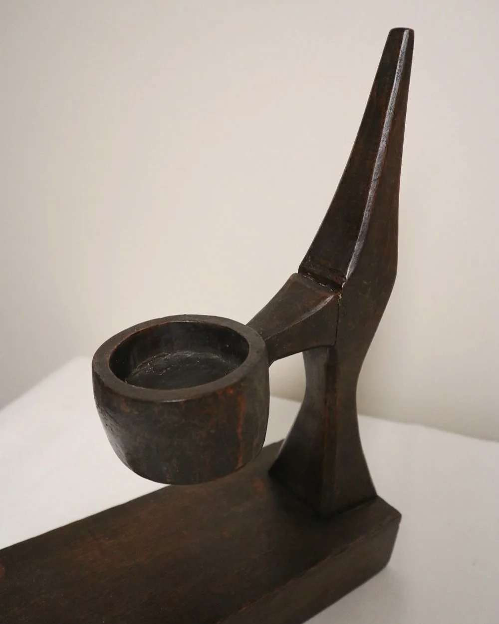 American hand carved dark wooden Brutalist candleholder with block base.