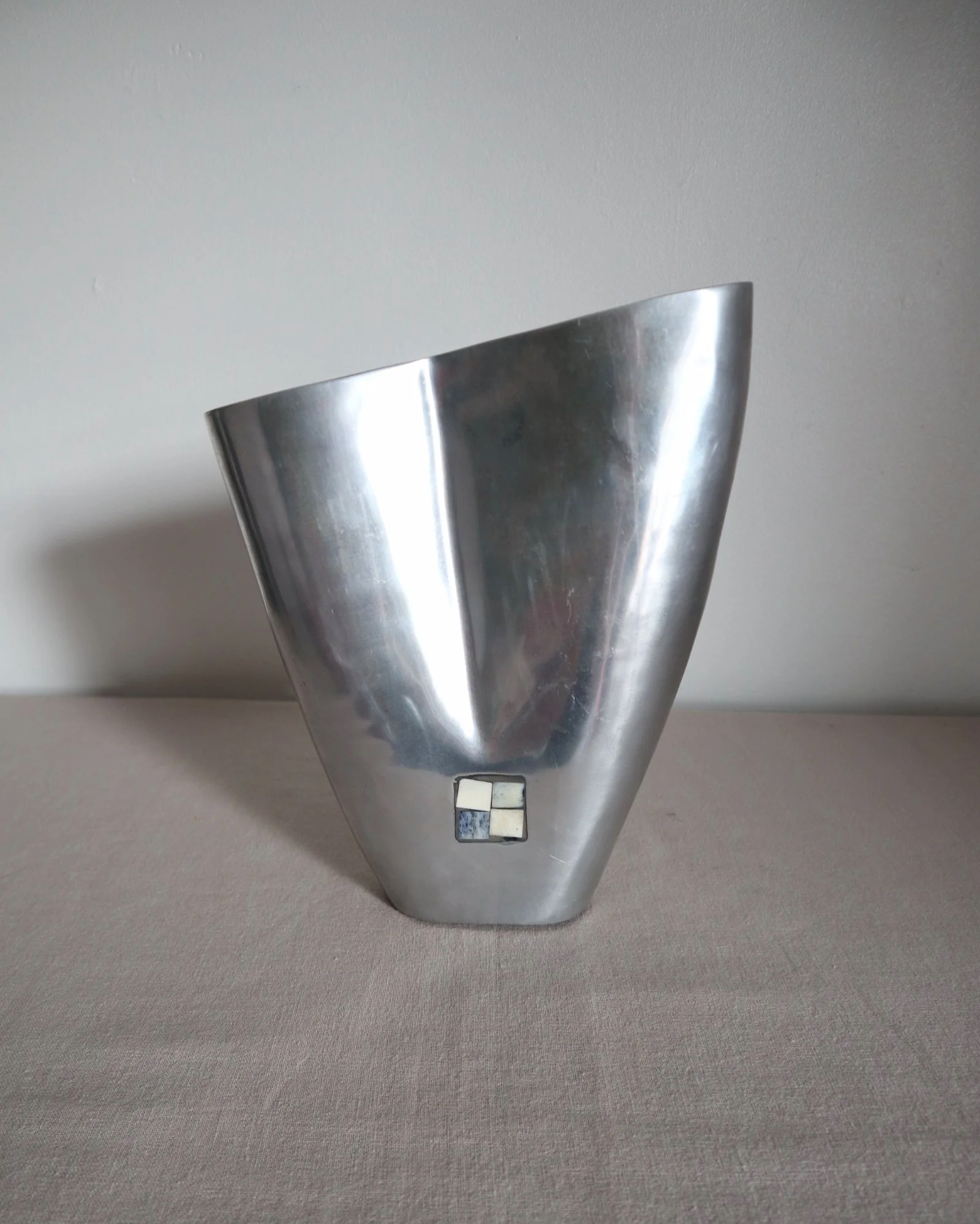 Postmodern heavy cast aluminium vase with sculptural form and four small inset stones. In the style of Anna Efverlund. Circa 1980s. Unsigned.