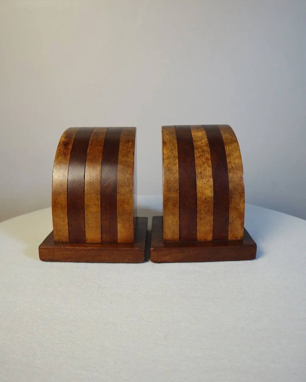 Vintage Art Deco style two tone arched wooden bookends.