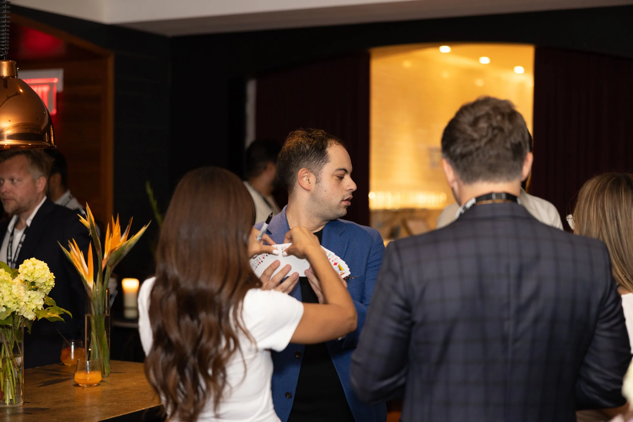 Toronto magician performing close-up magic during a corporate cocktail hour