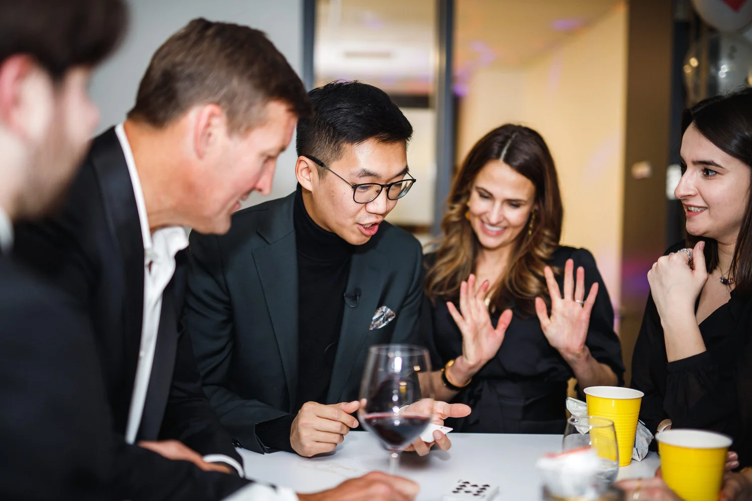Bao performing close-up magic for guests