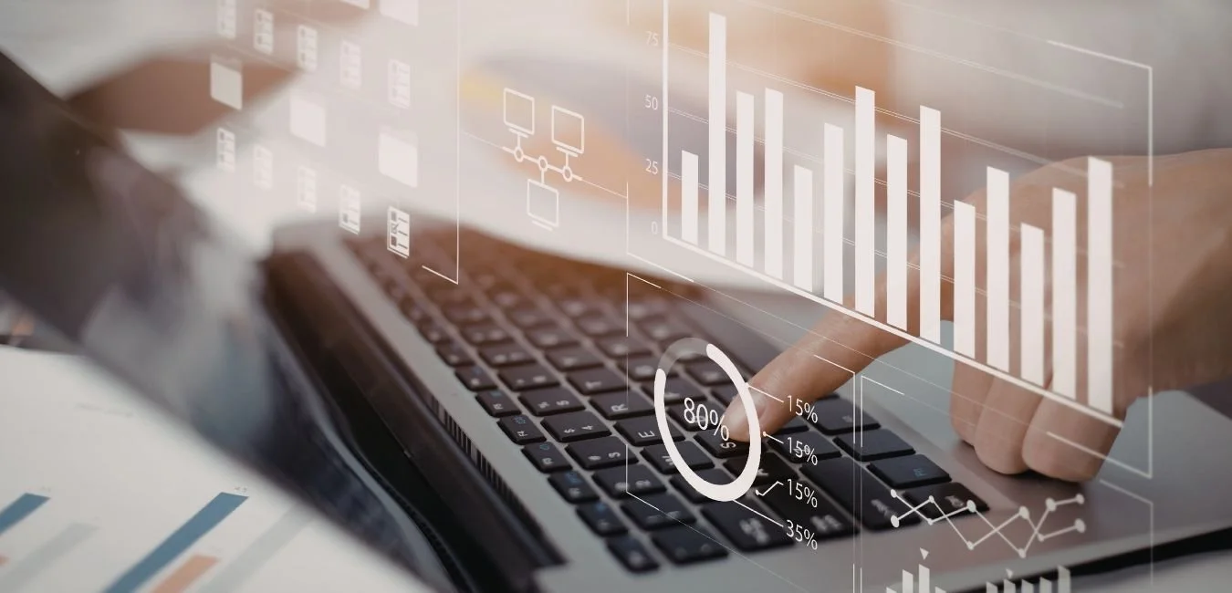 Financial modelling data visualisation overlaid on a laptop showing infrastructure and energy project financial charts