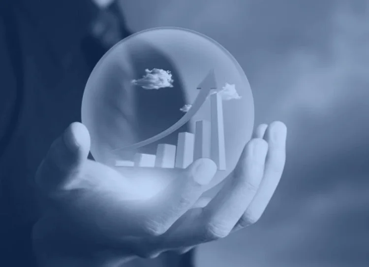 Hand holding a glass sphere with a rising bar chart inside