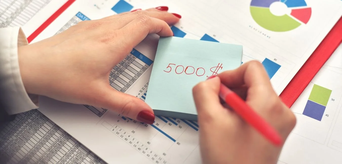 Financial modelling charts and handwritten notes for M&A analysis