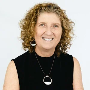 Lisa Dalla-Zuana, Executive Officer at MCM Housing, smiling against a white background