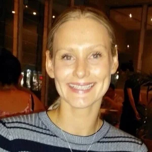 Miranda Bigmore, Finance Partner at Hester Hornbrook, smiling in a striped sweater