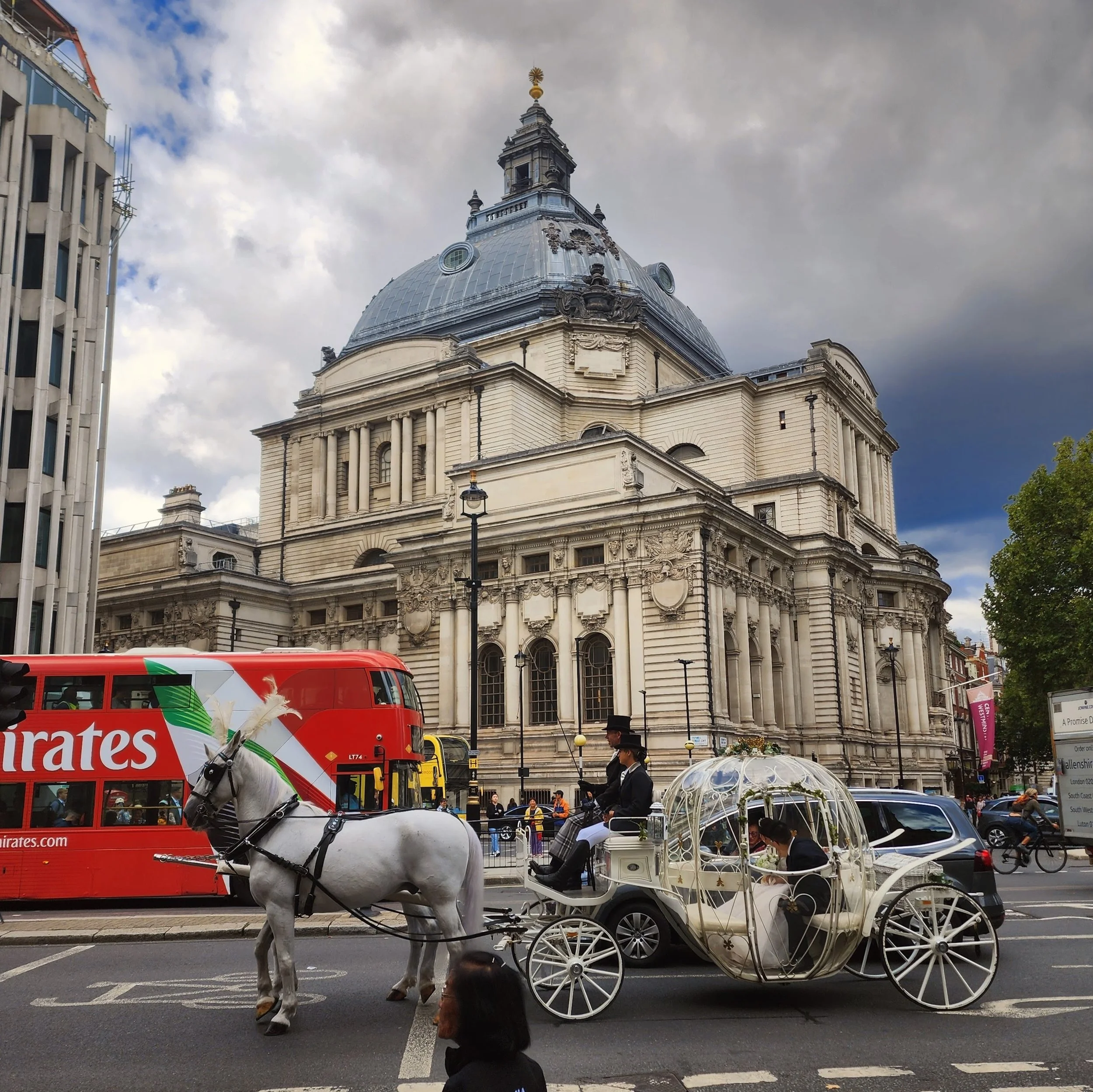 A fairytale coach and horses in front of Methodist Hall in Westminster, London