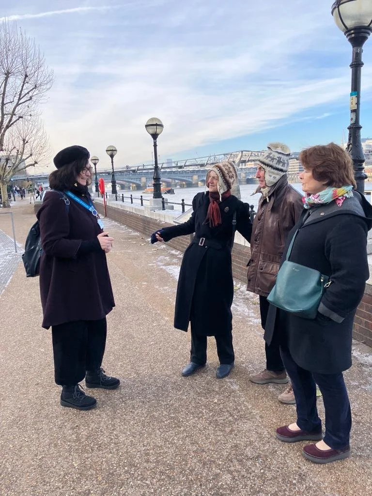 A guide with a group of tourists in London
