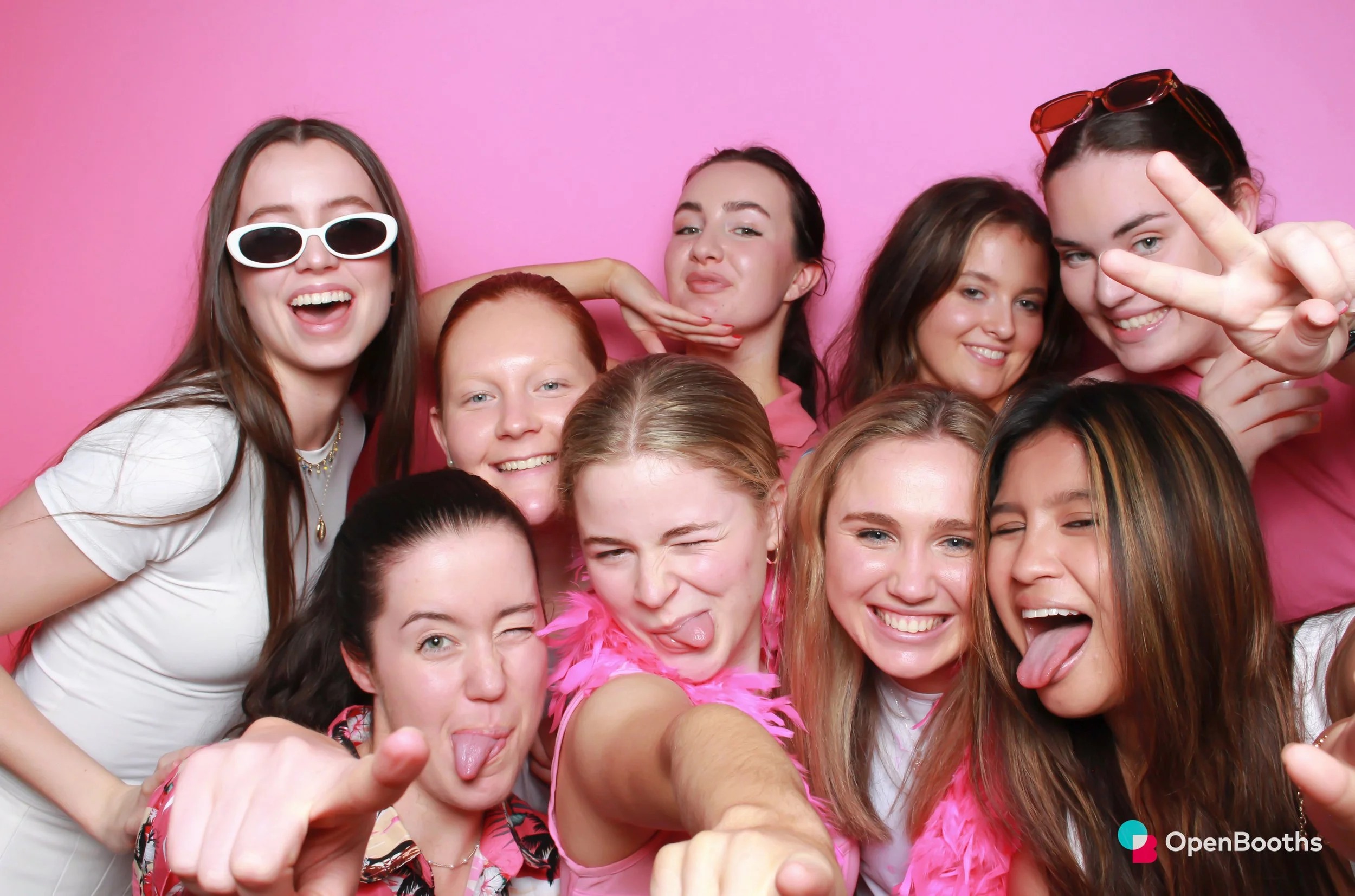 Open Booths photo booth image of a Poppin' Pink backdrop and nine people
