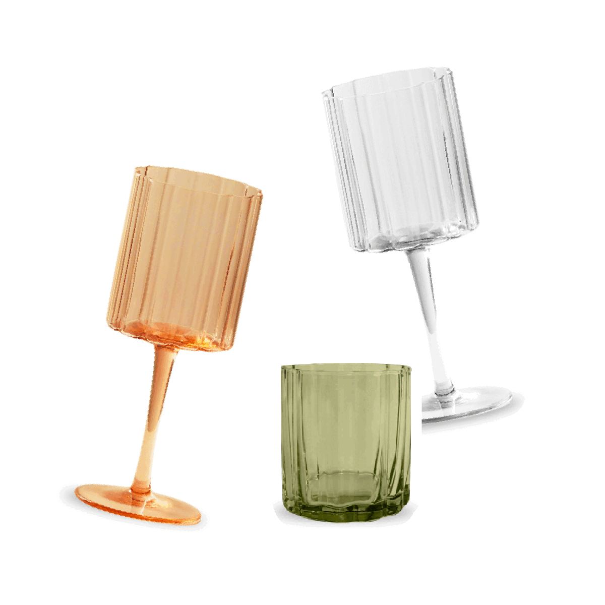 Three colored glass tumblers, one orange, one clear, and one green, arranged on a dark background.