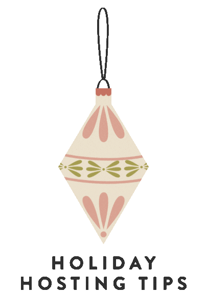 Decorative Christmas ornament hanging from a black string, with a pastel pink and green pattern on a cream-colored background.