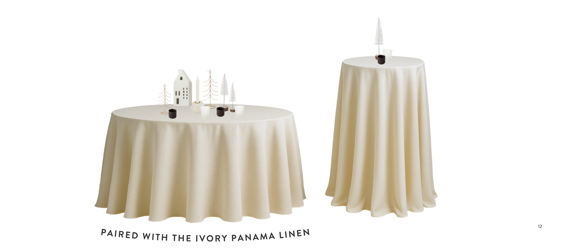 Two tables with cream-colored tablecloths, decorated with miniature Christmas figures, and a knife set on the taller table.
