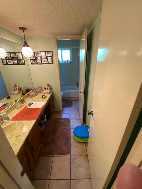 view of a family bathroom in austin texas before the remodeling project