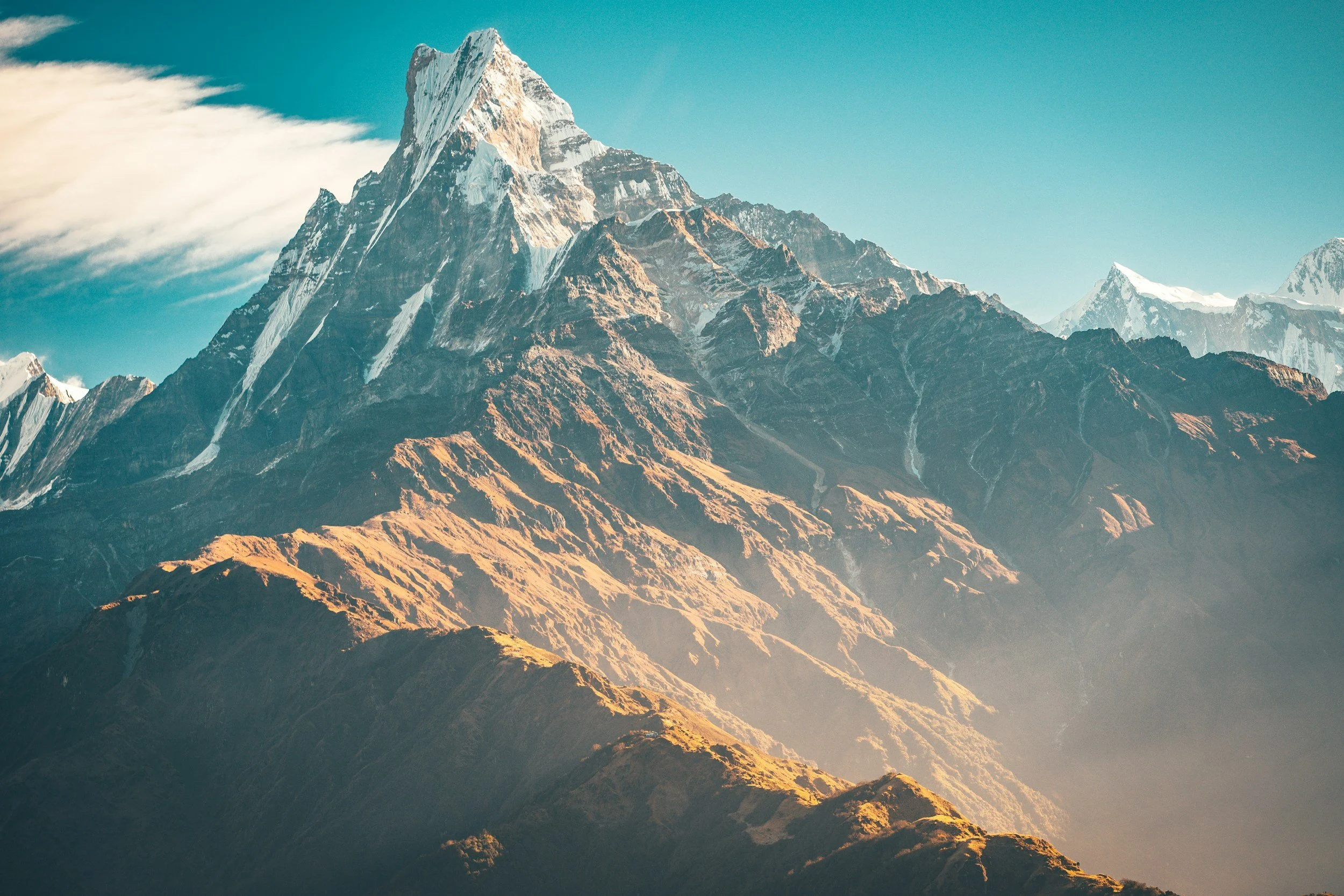 Sunlit mountain peak symbolising new perspectives and possibilities for personal change.