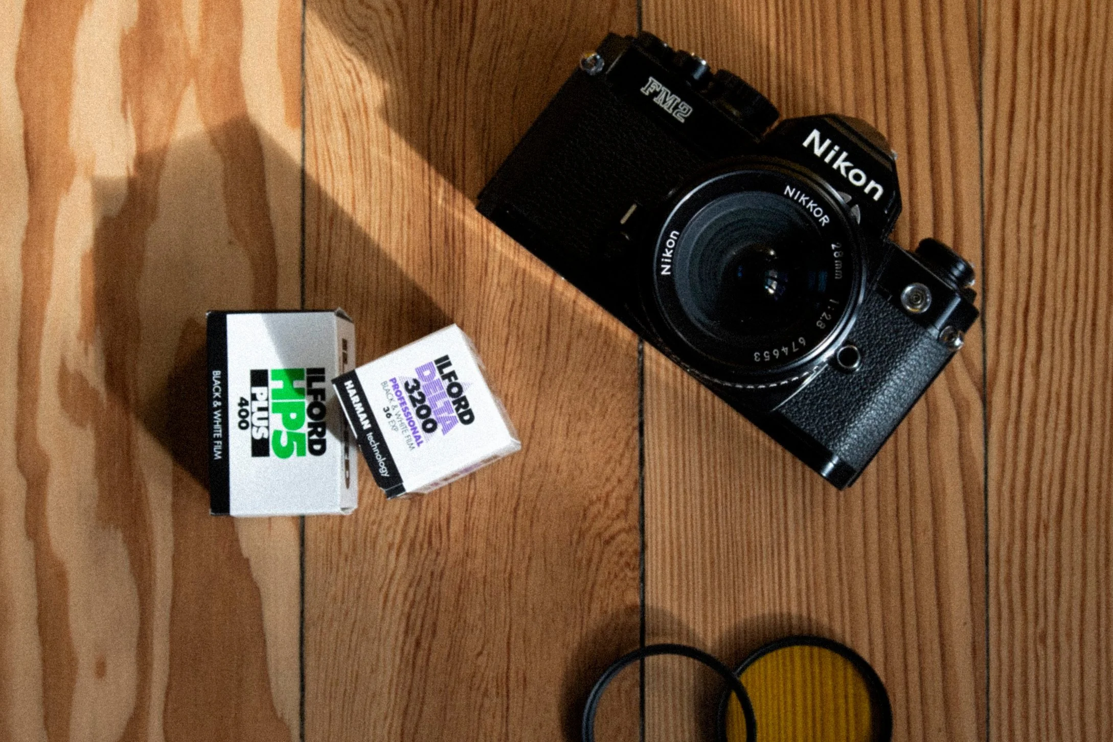 Best SLR film camera for beginners Canon AE1 vs. Nikon FM — Visual Journey