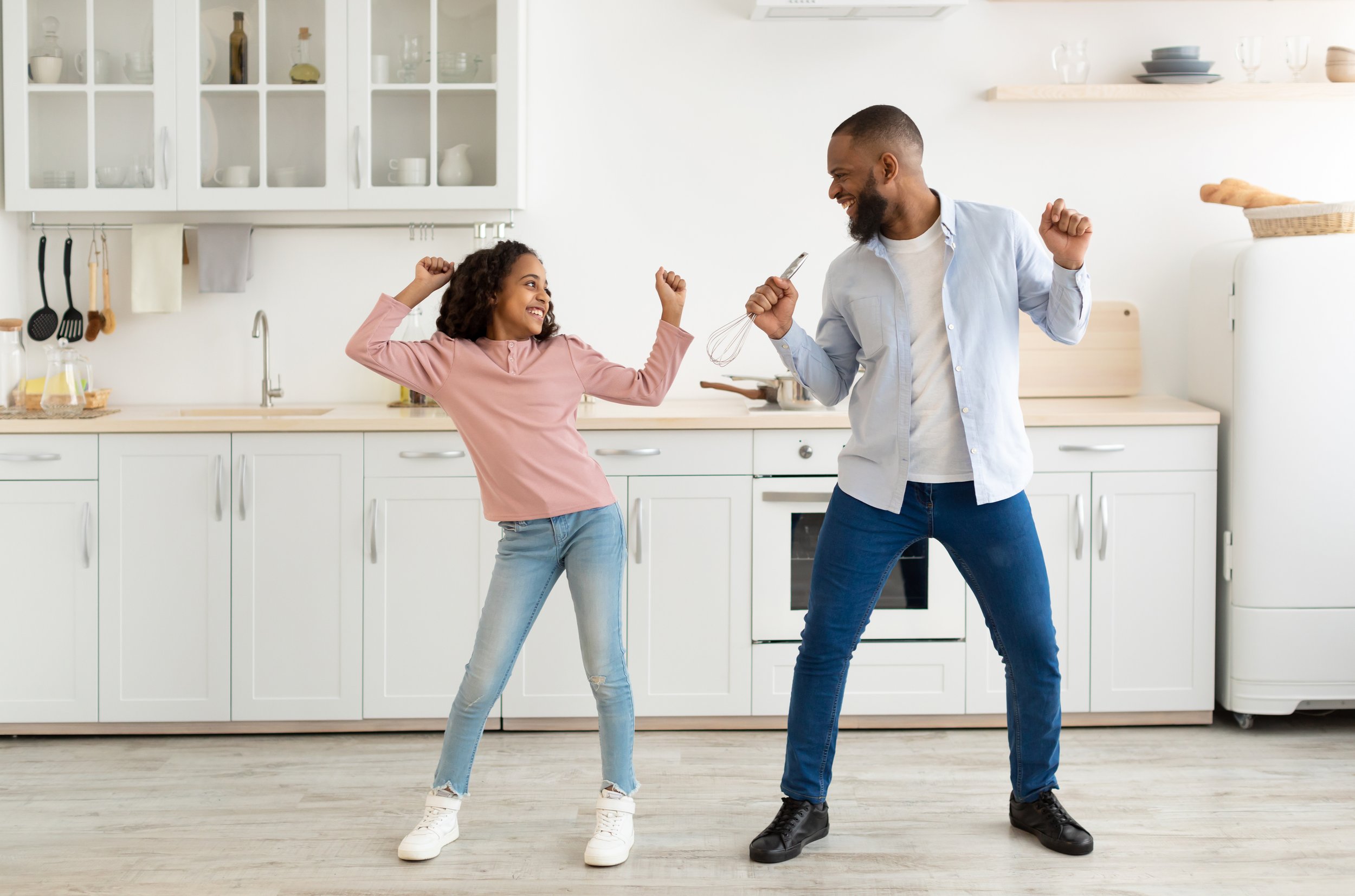 Dad and Daughter Singing in Kitchen.jpeg