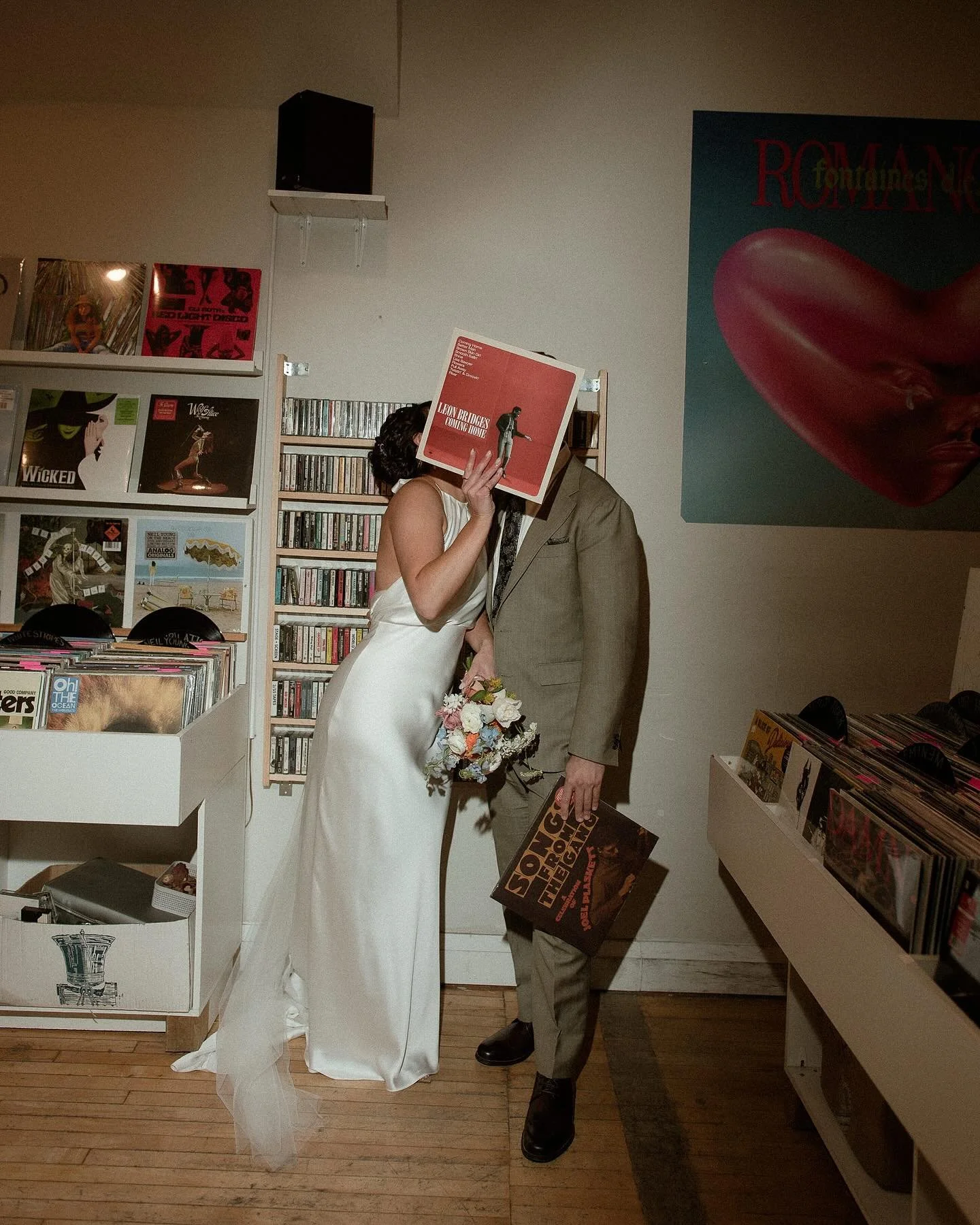 Rebecca and Drew, adventuring around town on their wedding day. Shopping for records, going to a Korean diner for drinks and visiting Rebecca&rsquo;s iconic Nonna before getting married at @propellercoffeeco. It just so happens to be my favourite cof