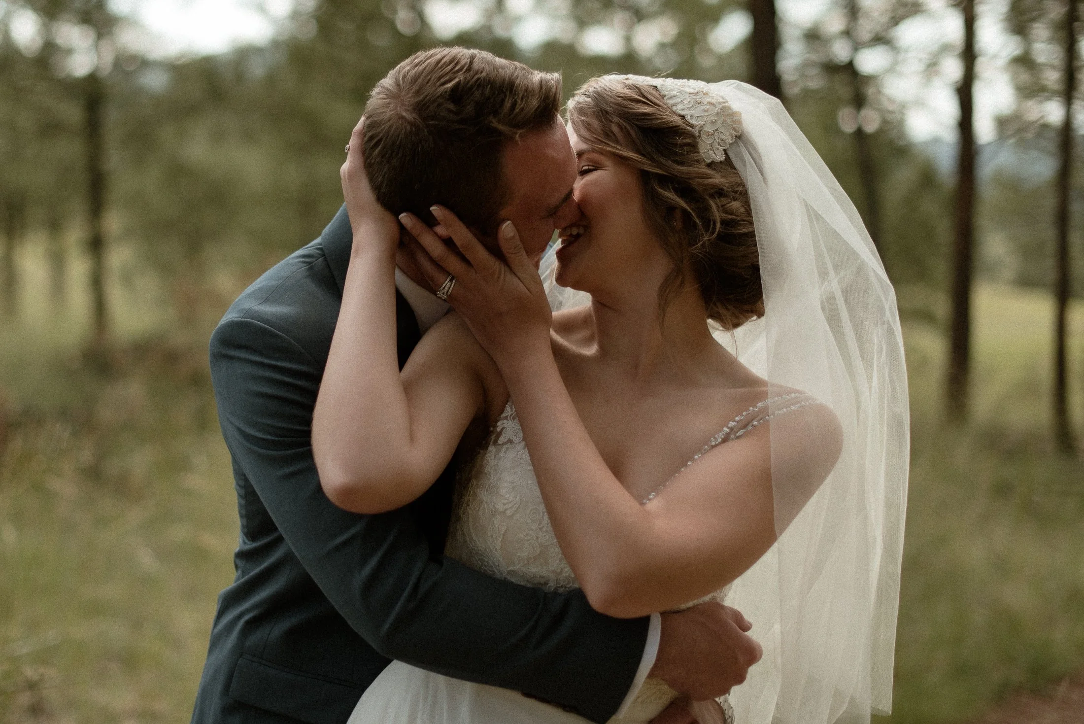 bride and groom in montana kissing in a forest