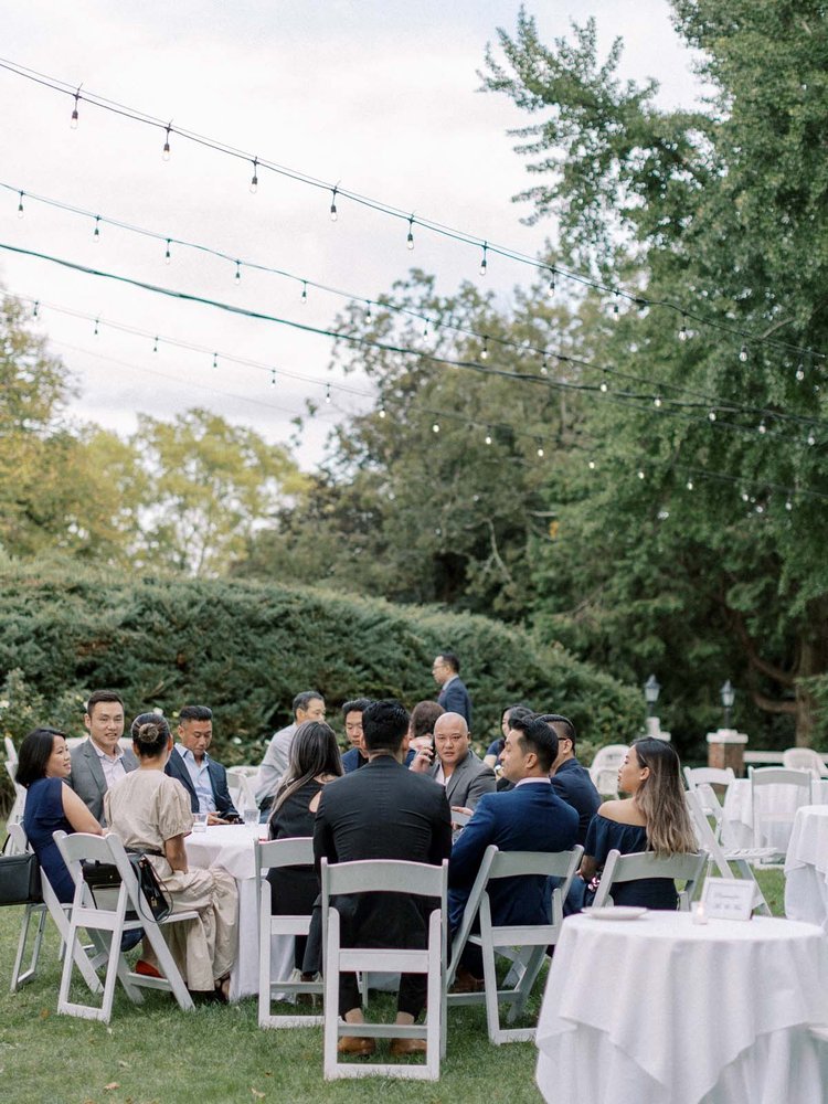 outdoor CT wedding reception with string lights overhead