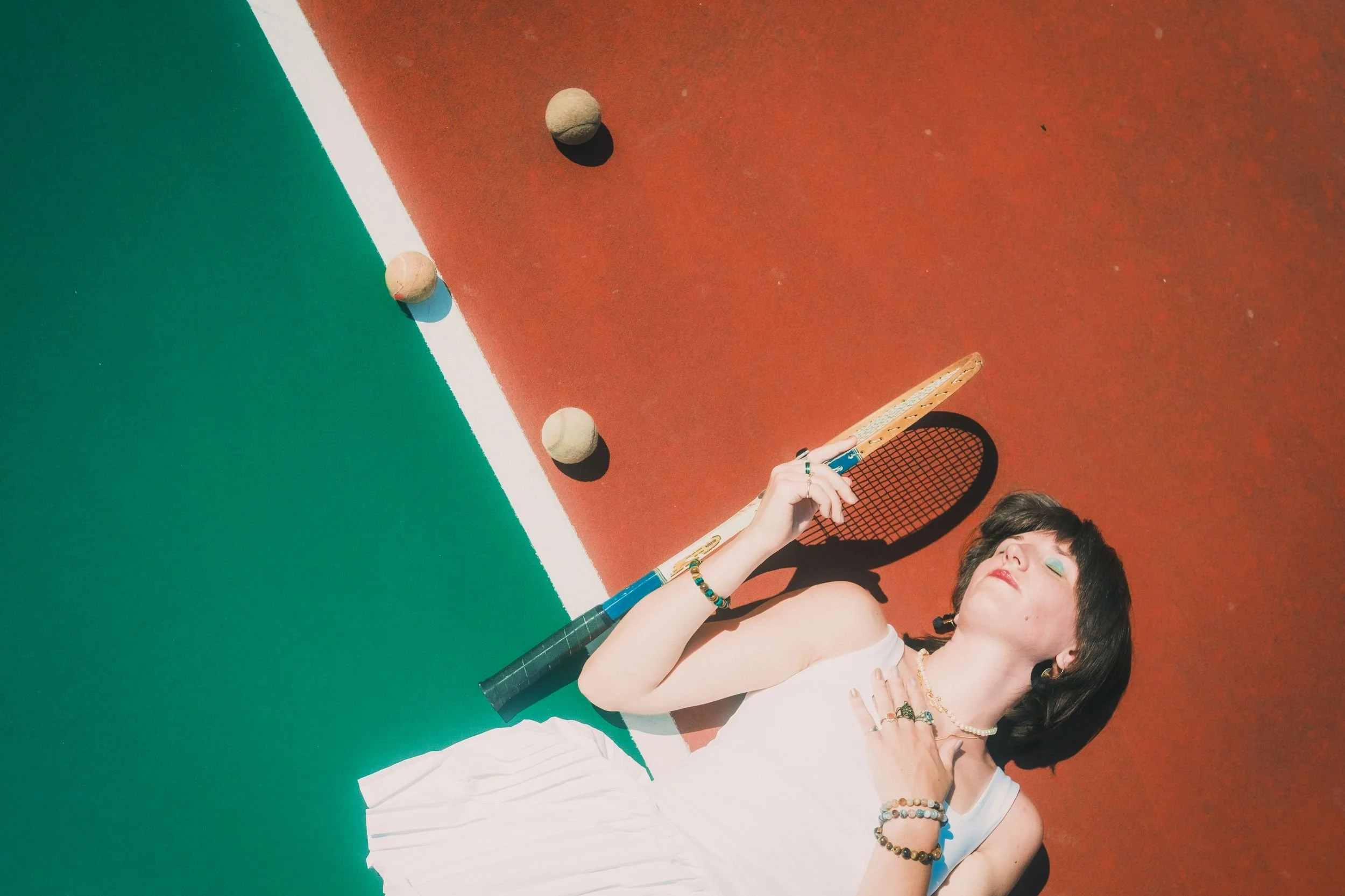 nicollete-tennis-editorial-overhead-tennis-balls.jpg