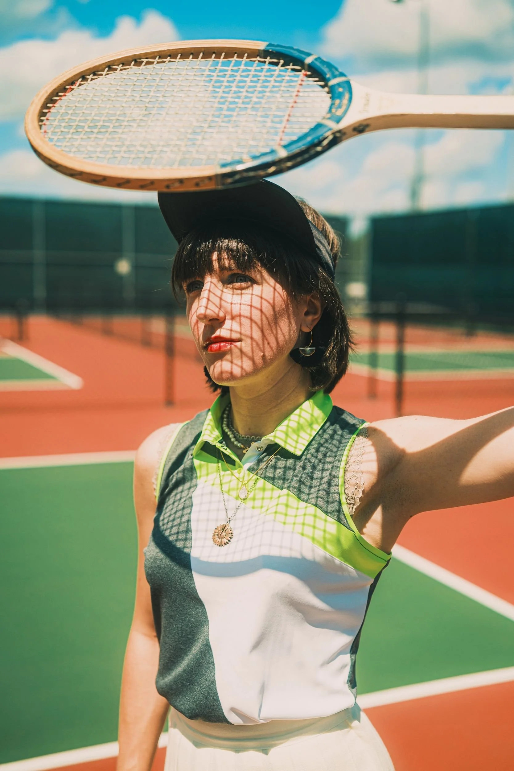 nicollete-tennis-editorial-racket-balanced-overhead.jpg