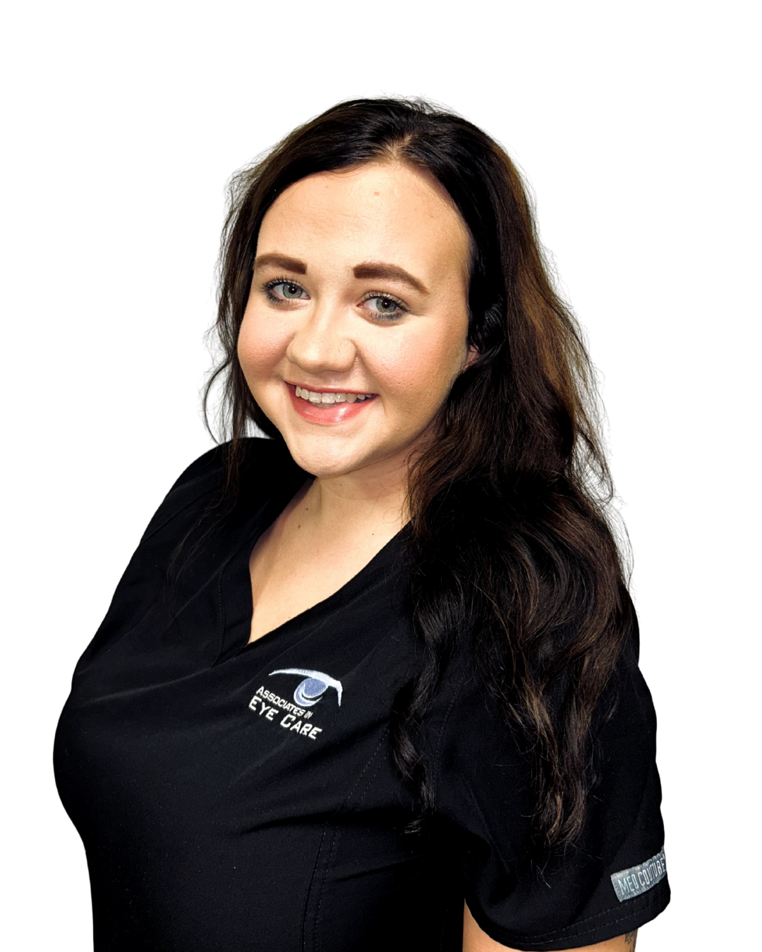 Smiling woman with long dark hair wearing a blue shirt
