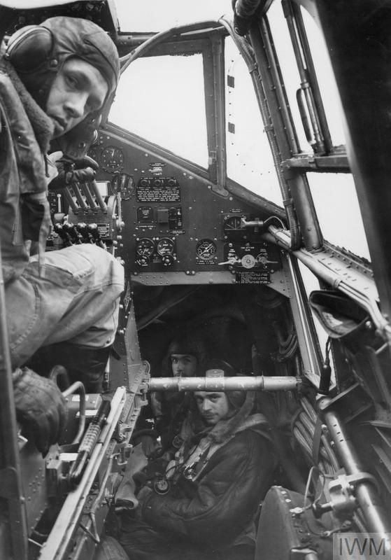 RAF Bomber Pilot in cockpit in WW2 black and white.jpg