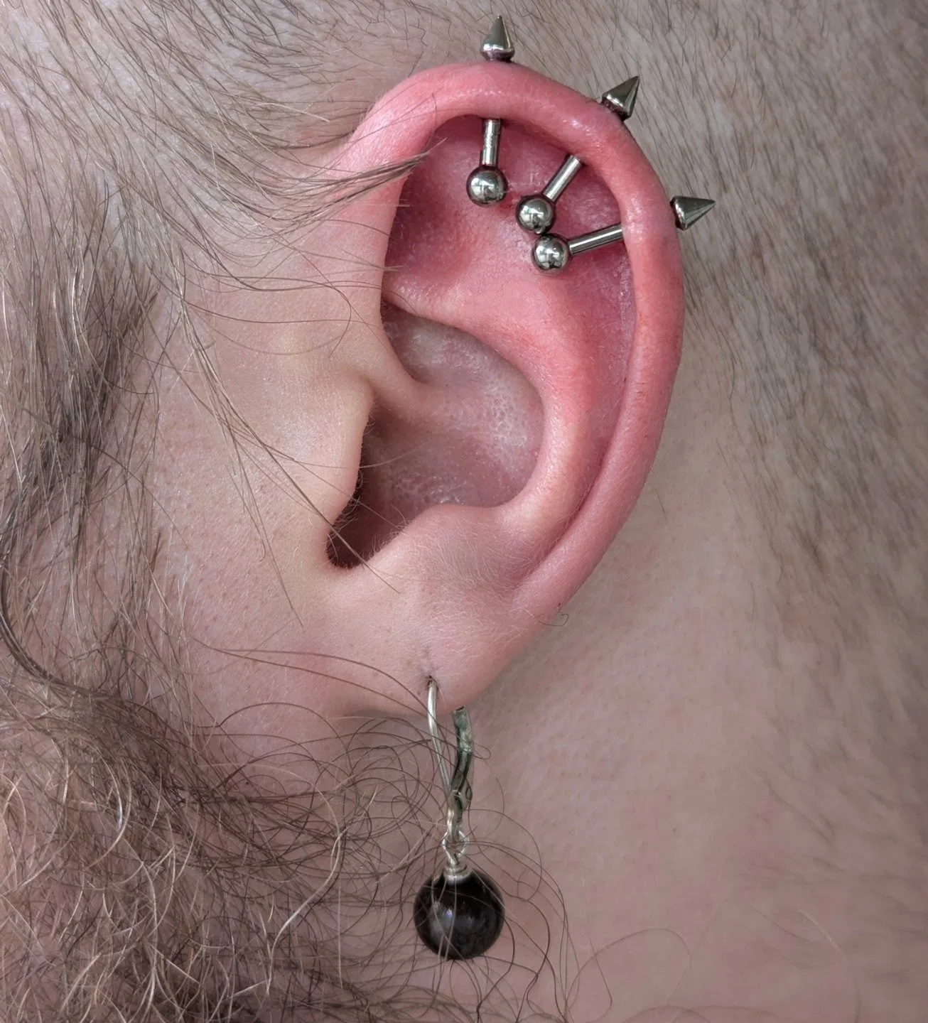 Everyone please stop scrolling and behold Matthew's &quot;ear mohawk&quot;! Done with @cascadebodyjewelry posts and @junipurrjewelry spikes. Once these baddies are downsized they will have more of a &quot;floating&quot; look, but for now his ear is s