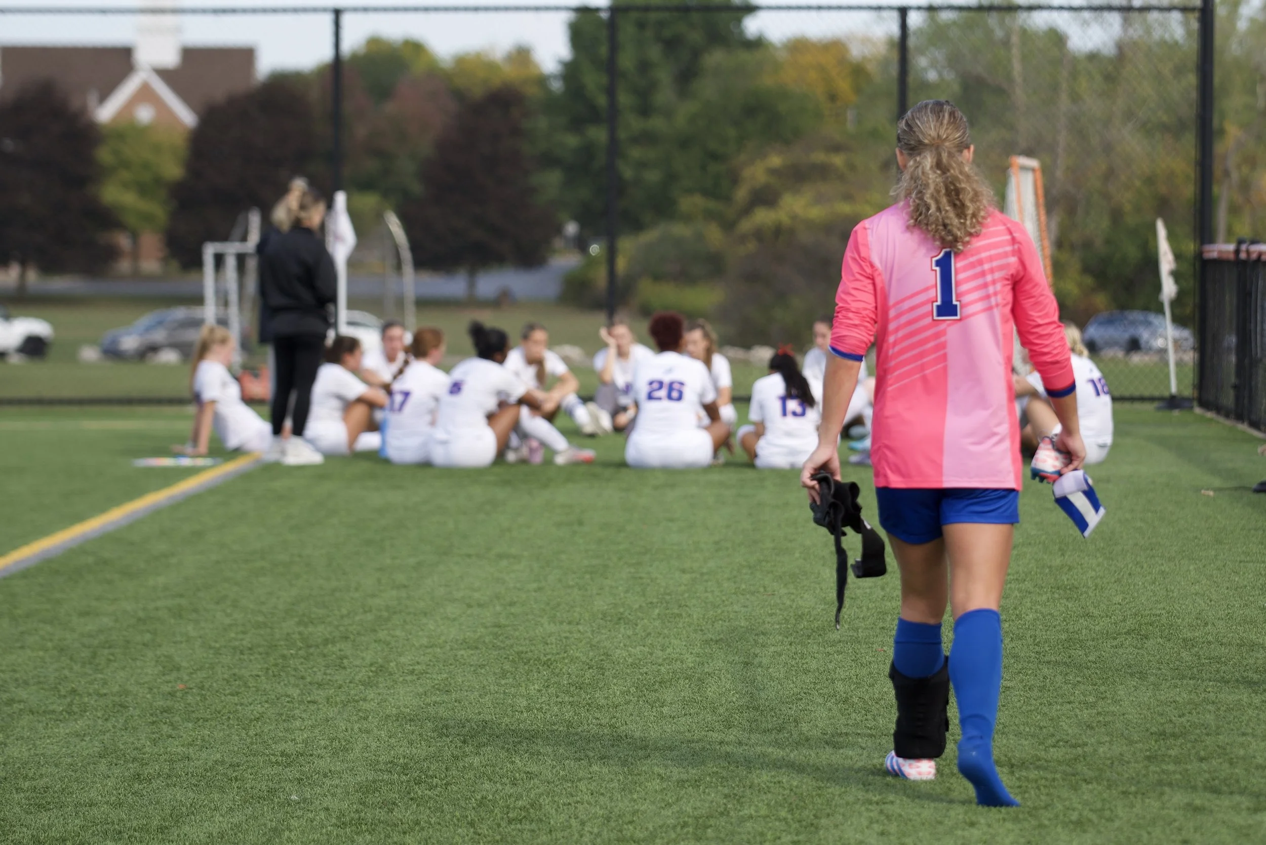 Teen Athlete walking on field in grounded confidence