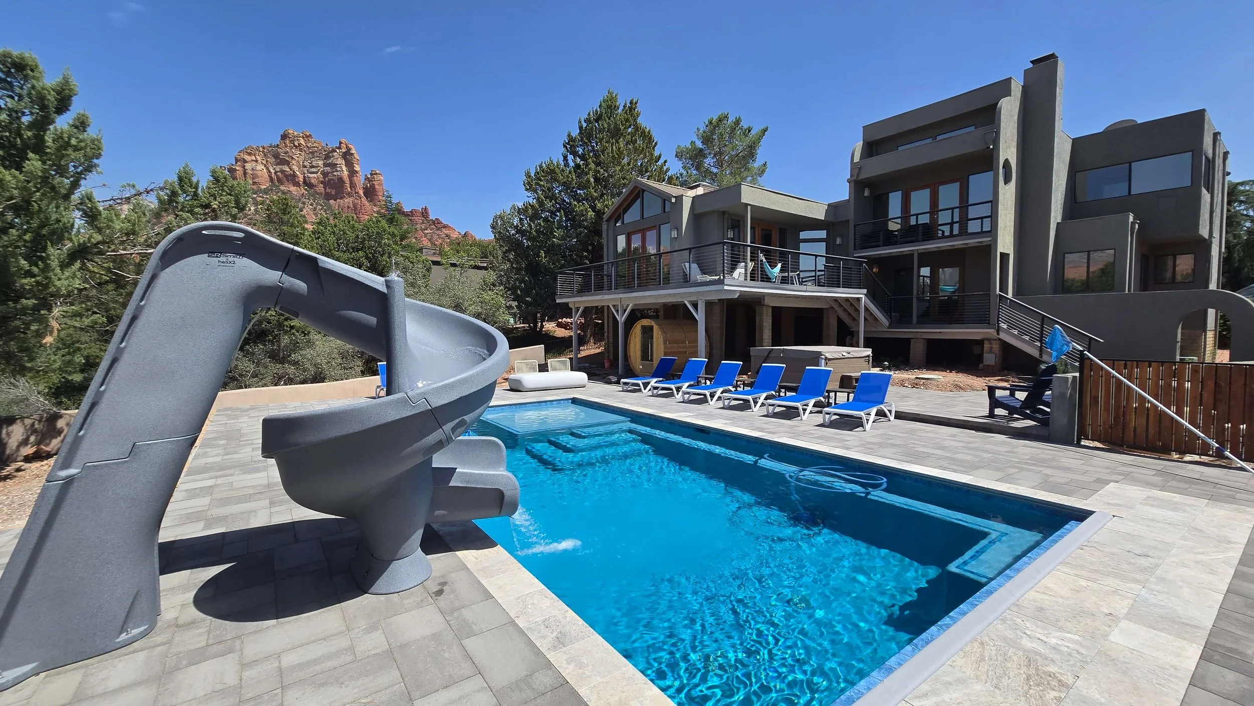 Supreme, a Sedona home with a spiral waterslide into the pool, barrel sauna, hot tub and Red Rock views from every deck