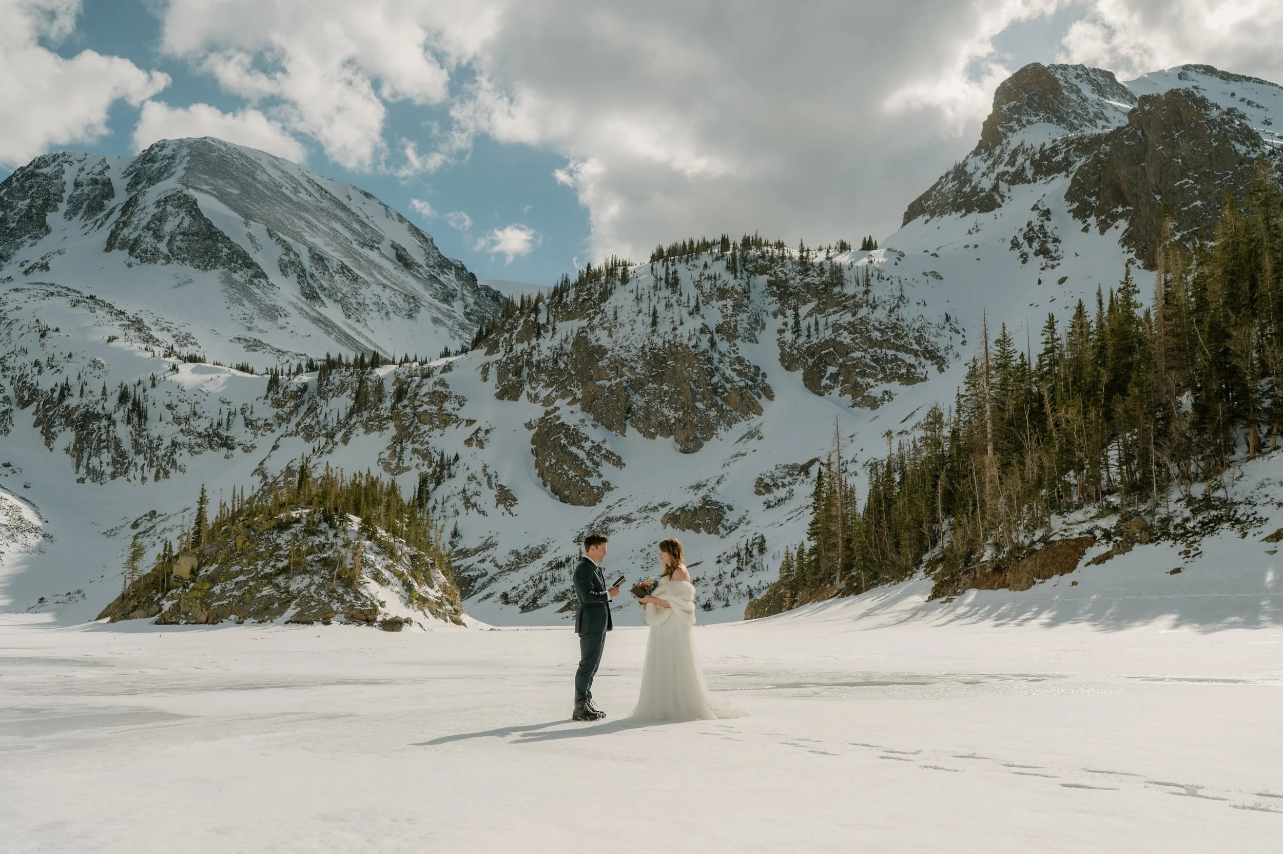 winter elopement photo of them saying their vows