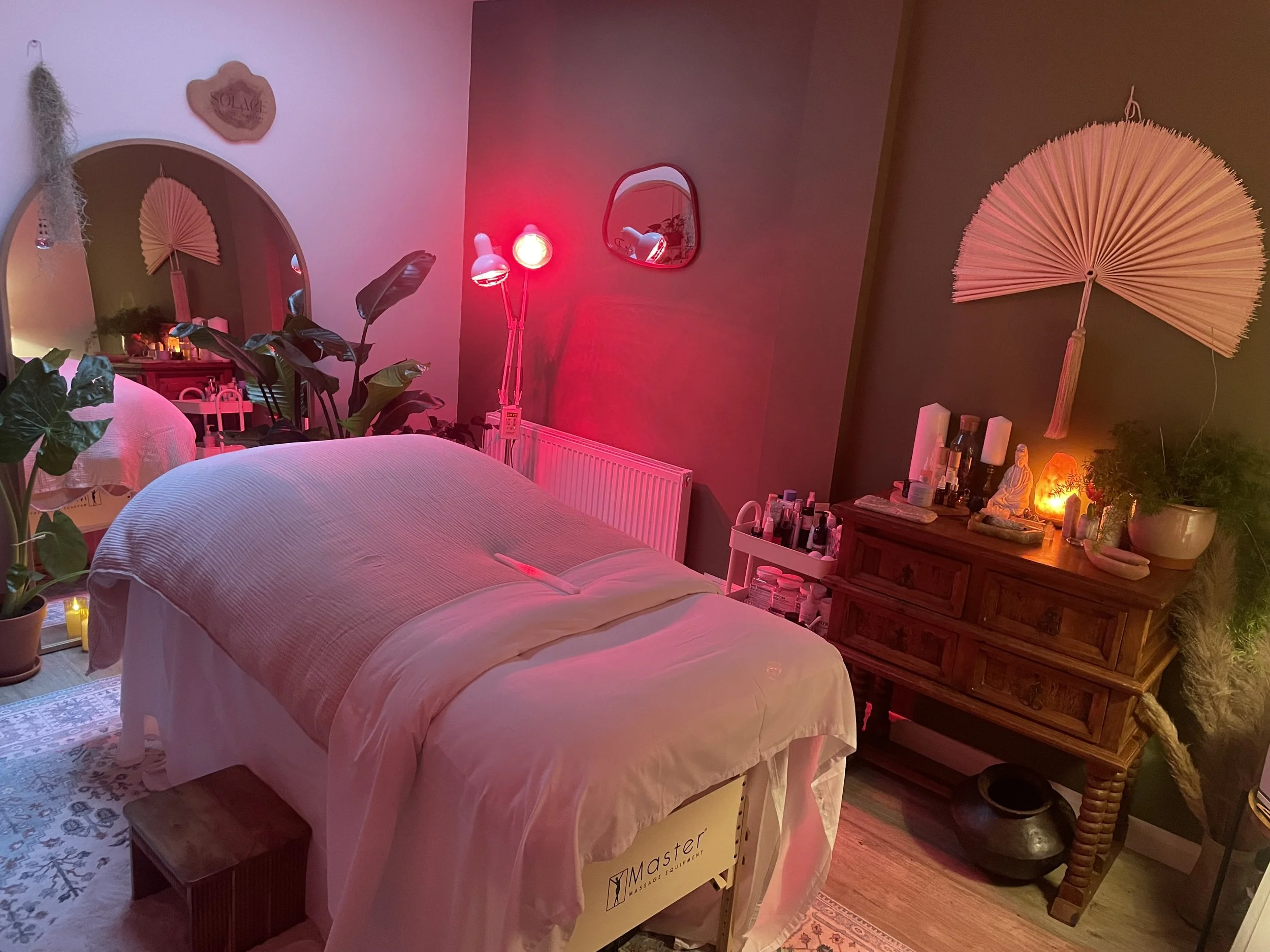 Person receiving a facial treatment in a spa or salon.