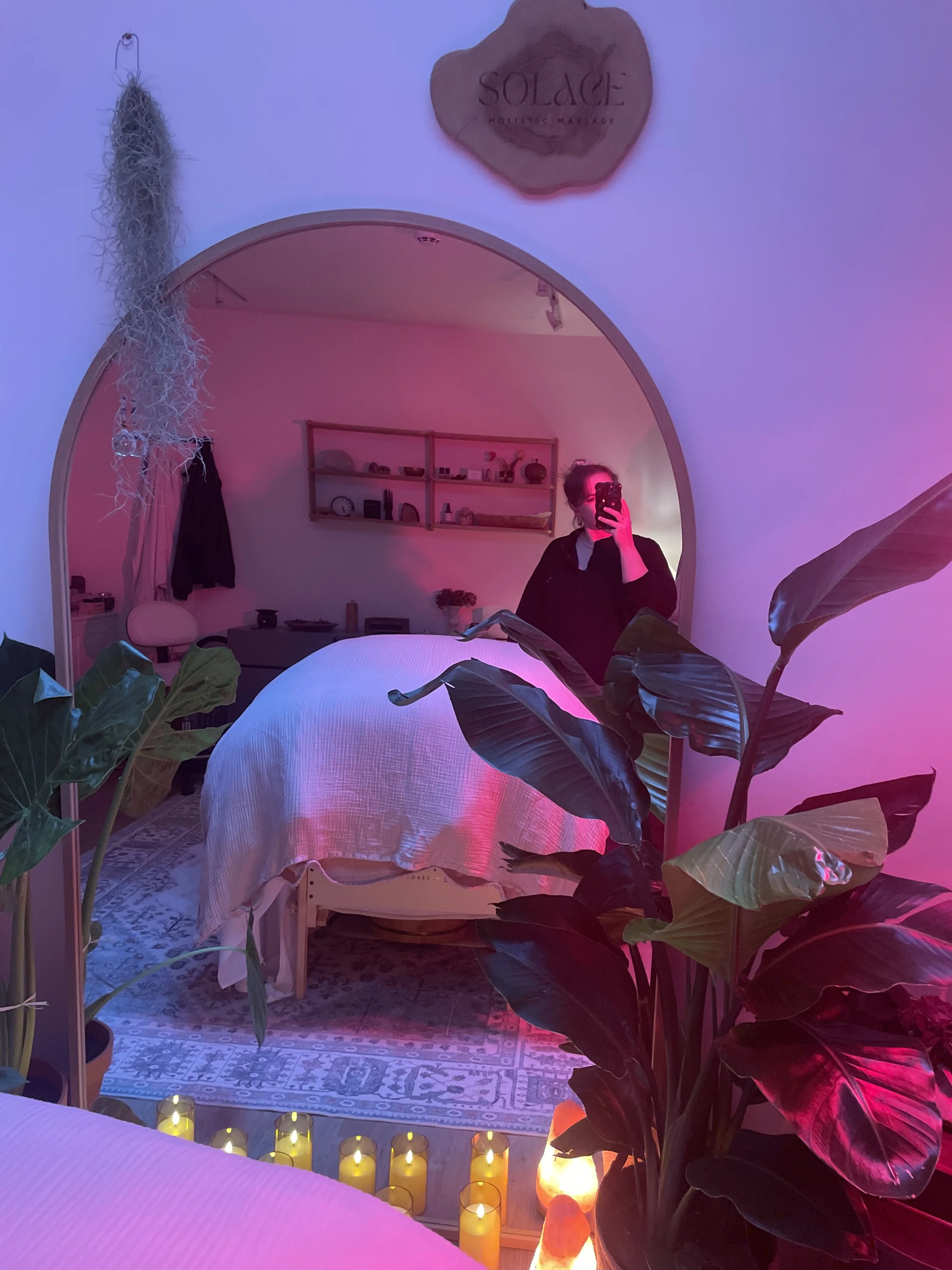 Person receiving a face mask treatment at a spa, with steam rising and surroundings blurred.