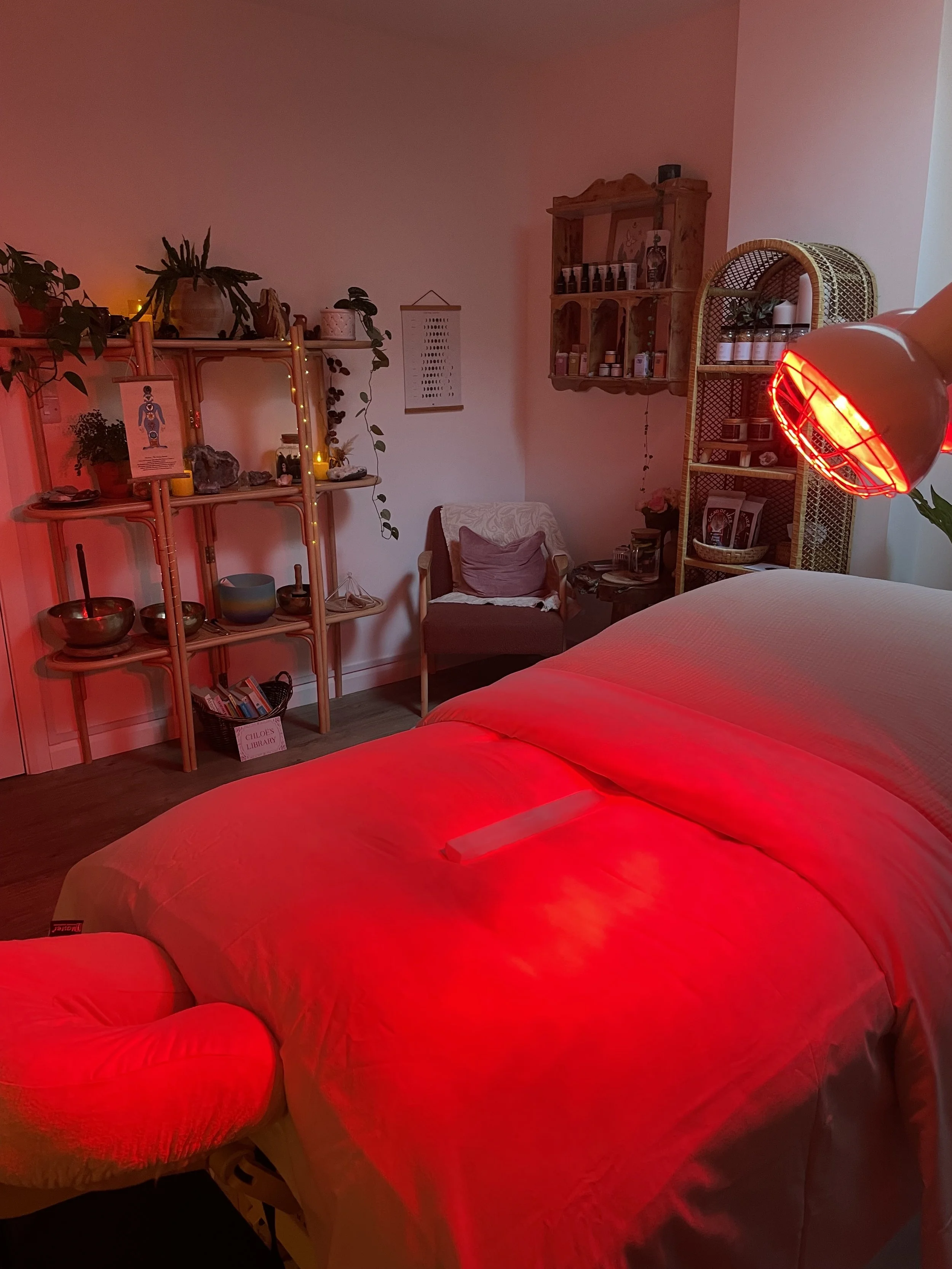 Person receiving a back massage with oil, hands pressing gently.