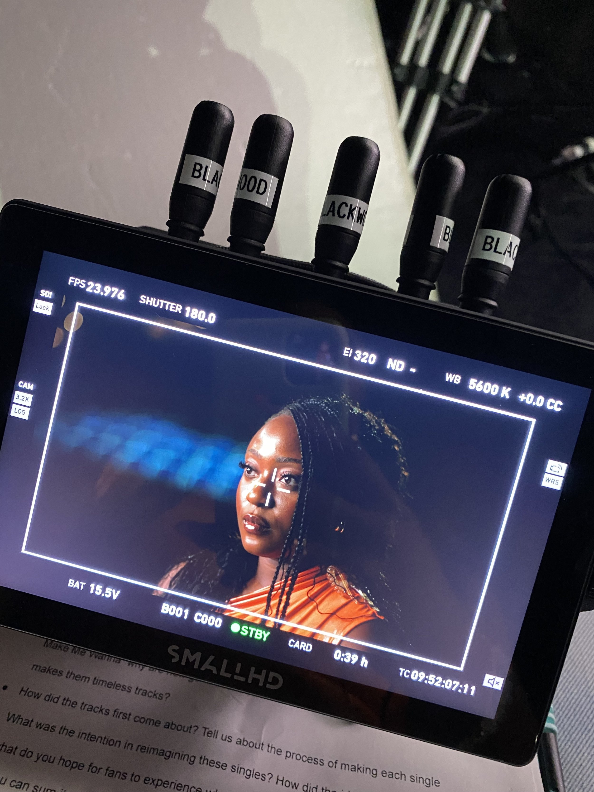 View of a camera monitor showing a close-up of Dolapo Sangokoya  on set