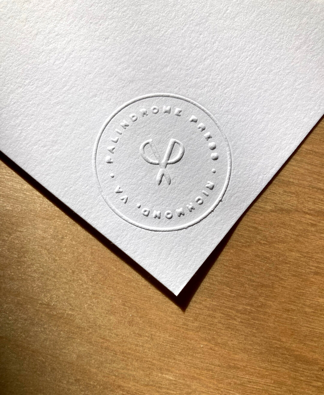 Today is a palindrome! 3.21.23 ​​​​​​​​
Here's a peek at our embossed design when mailing letterpress goods. The scissors are made out of the P's in our logo ✂️