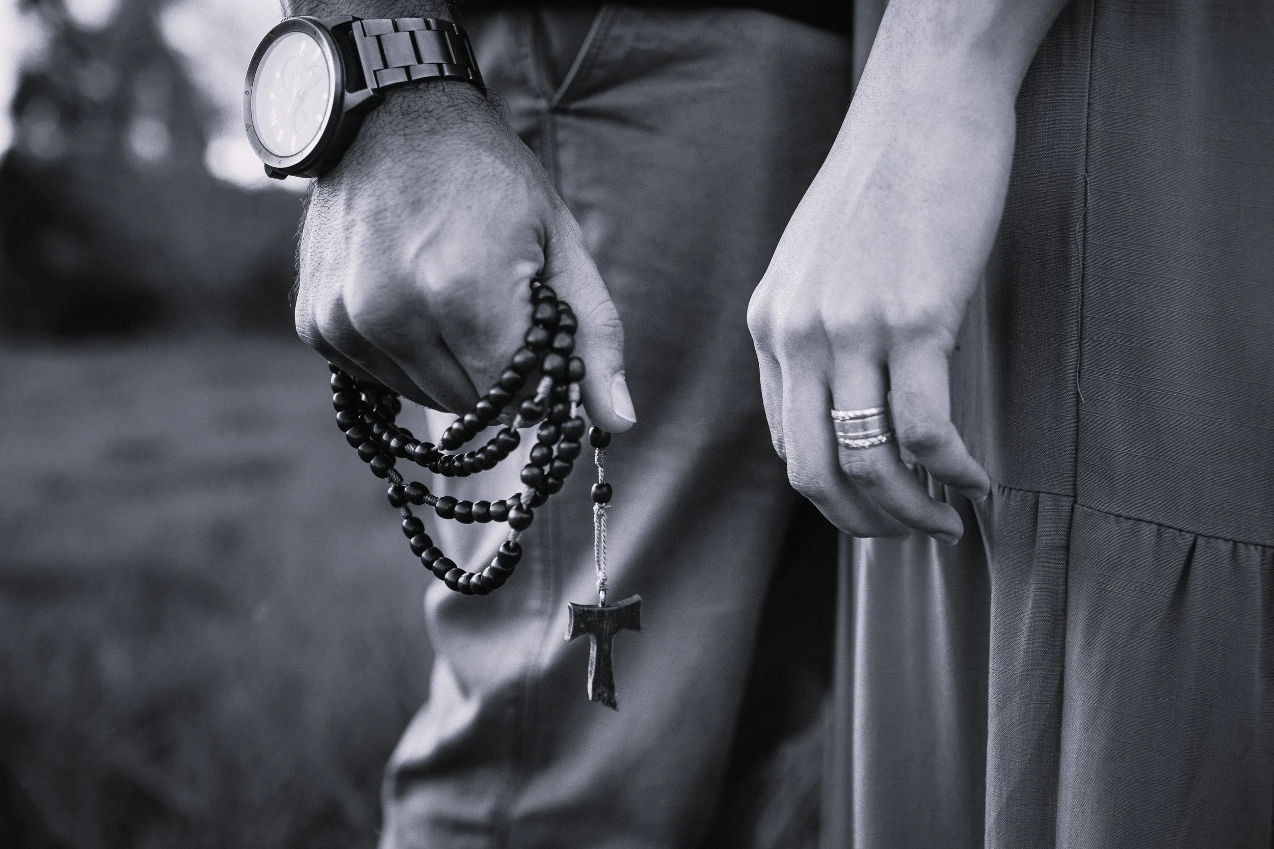 Couple standing together with rosary