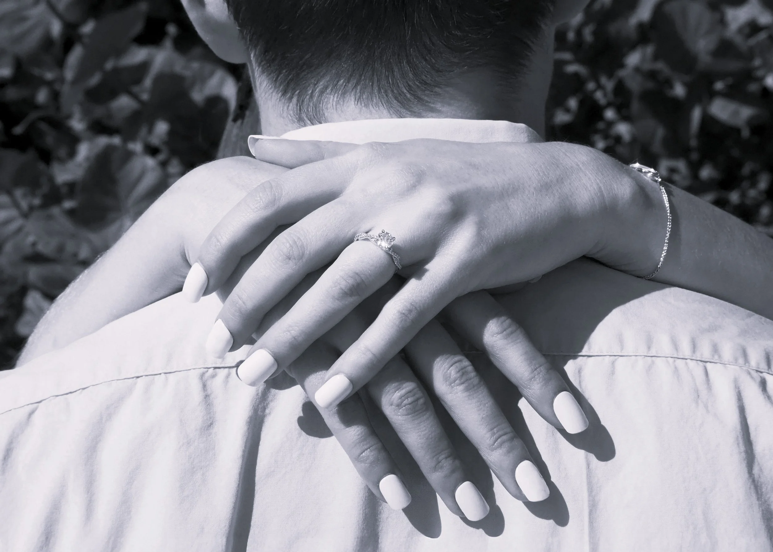 black and white photo of couple posing for engagement ring on her hand Premarital Counseling California