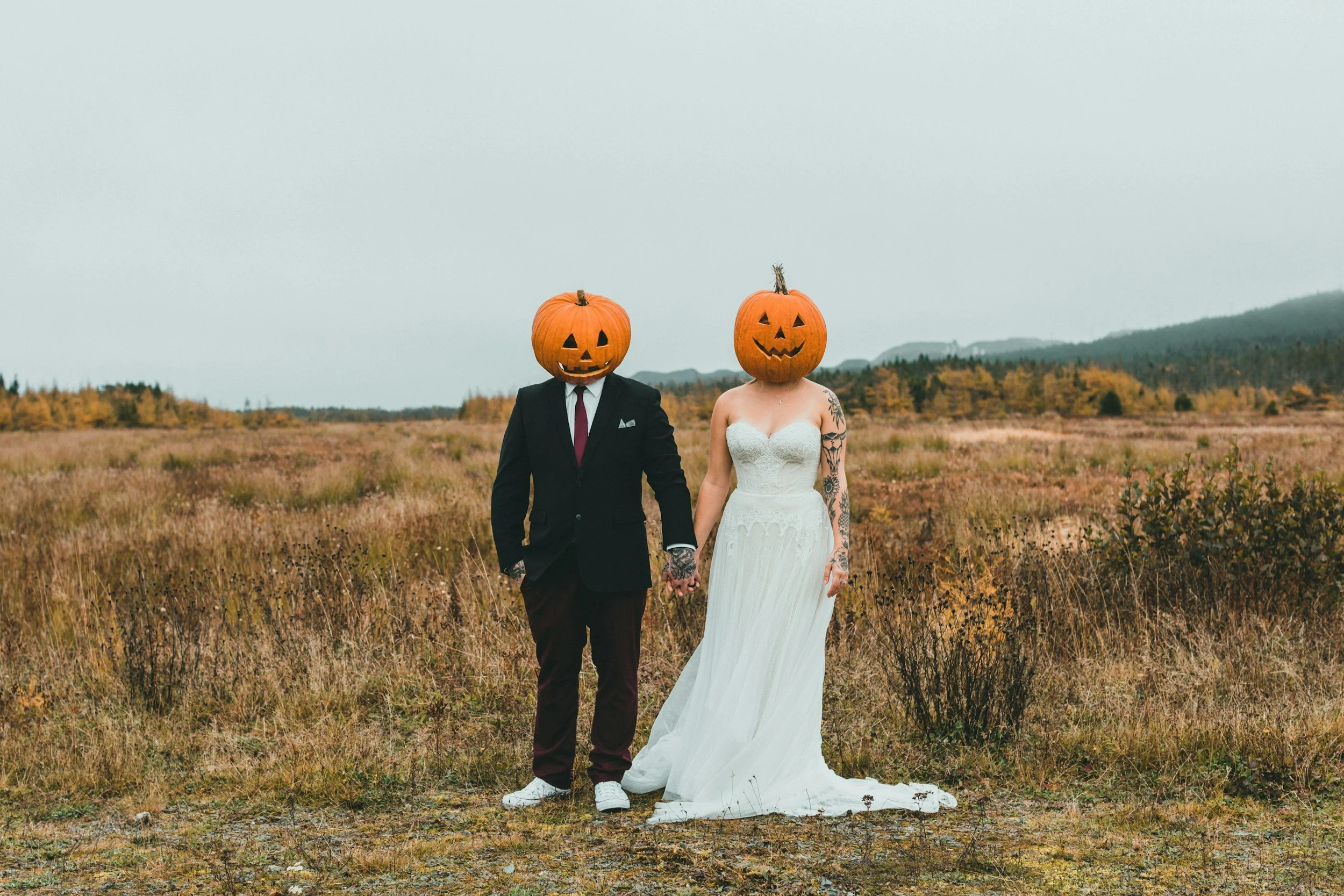 Black and white photo of couples with halloween pumpkins