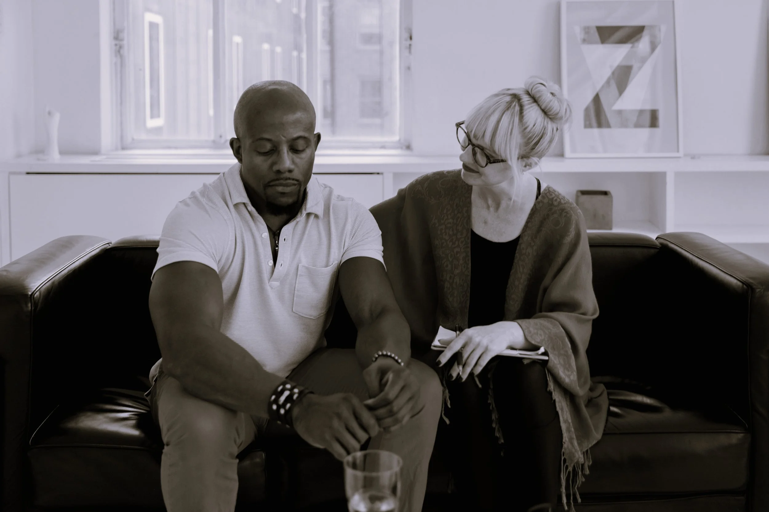 Couple talking on sofa