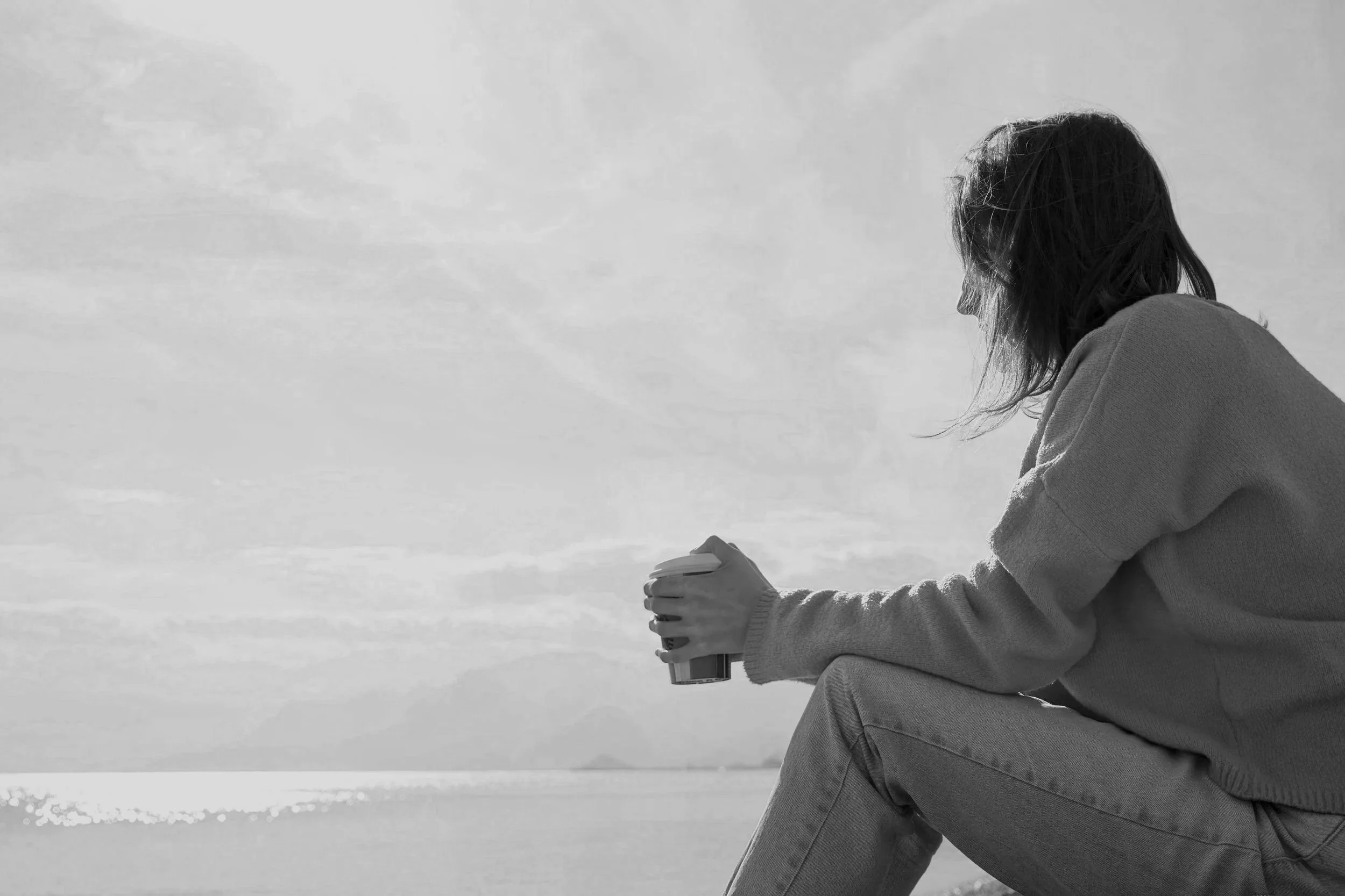 Black and white photo of woman sitting alone after affair.jpg