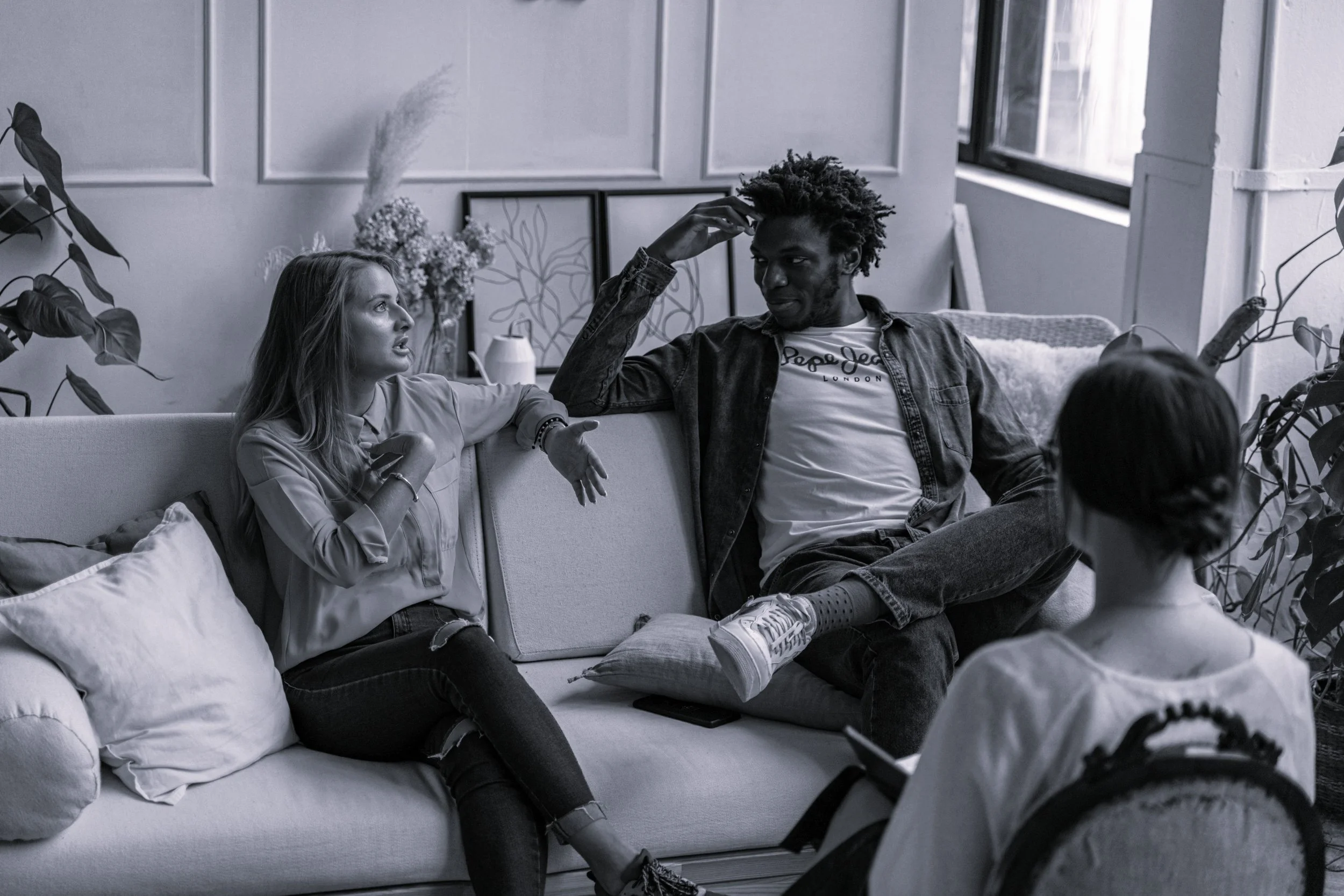 black and whote photo of couples talking in therapyPremarital Counseling California
