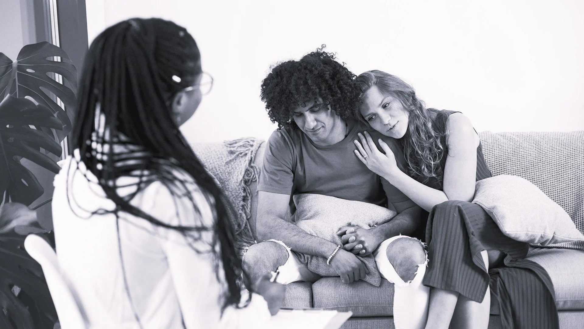 Black and white photo of couple getting therapy