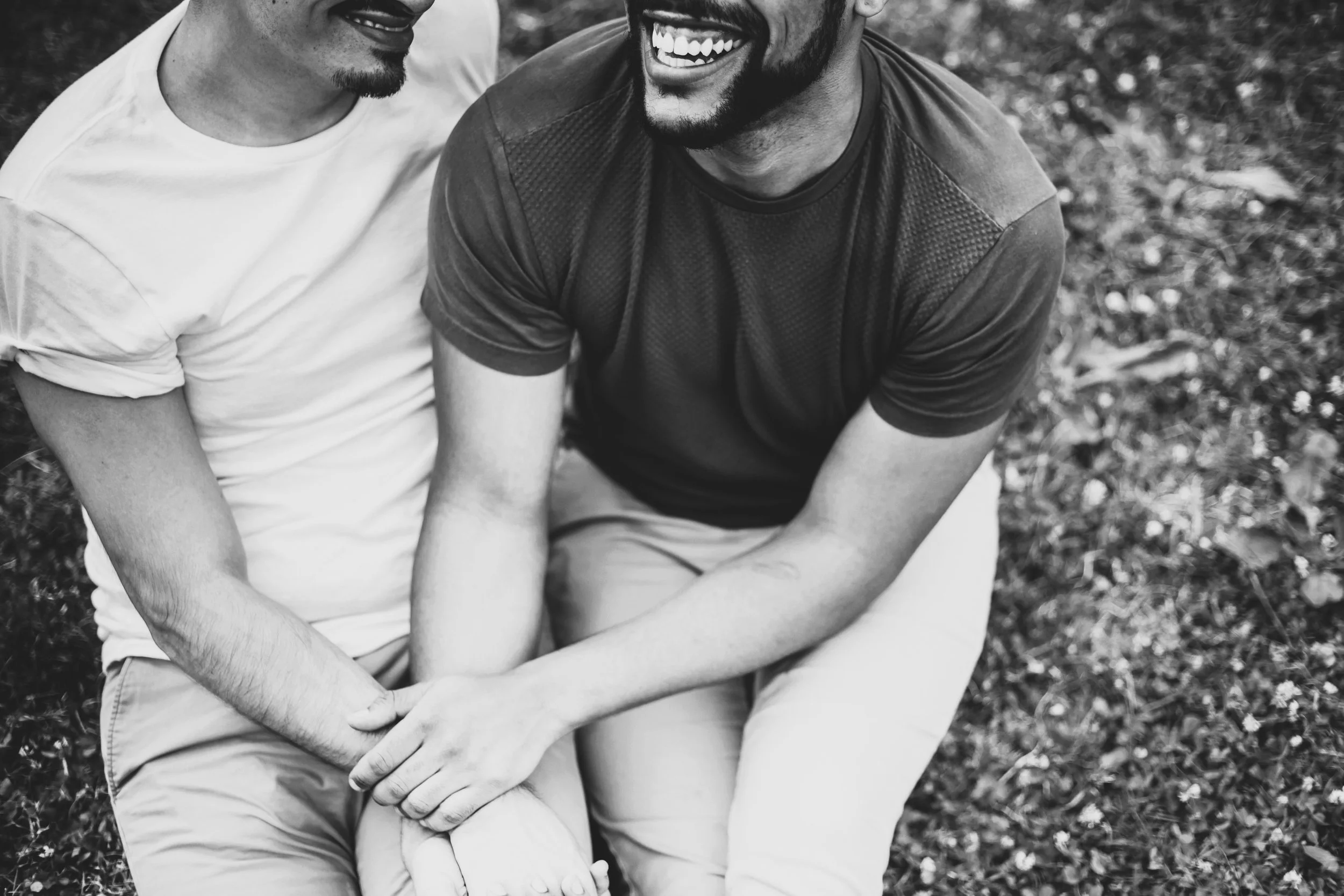 couple holding hands smiling
