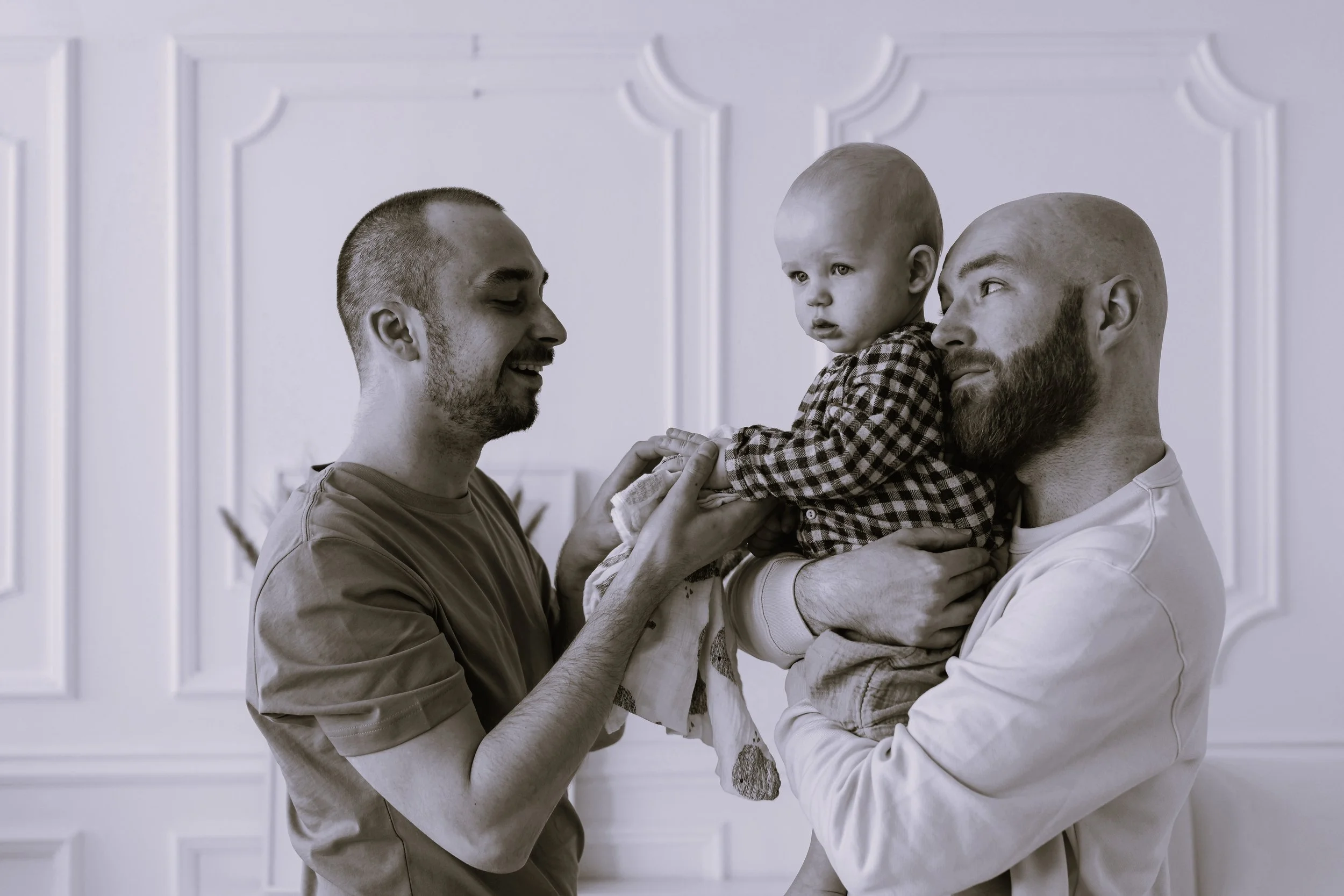 Couple holding small child