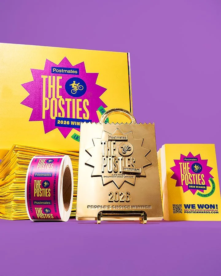 Close-up of The Posties award packaging with custom presentation box and branded award