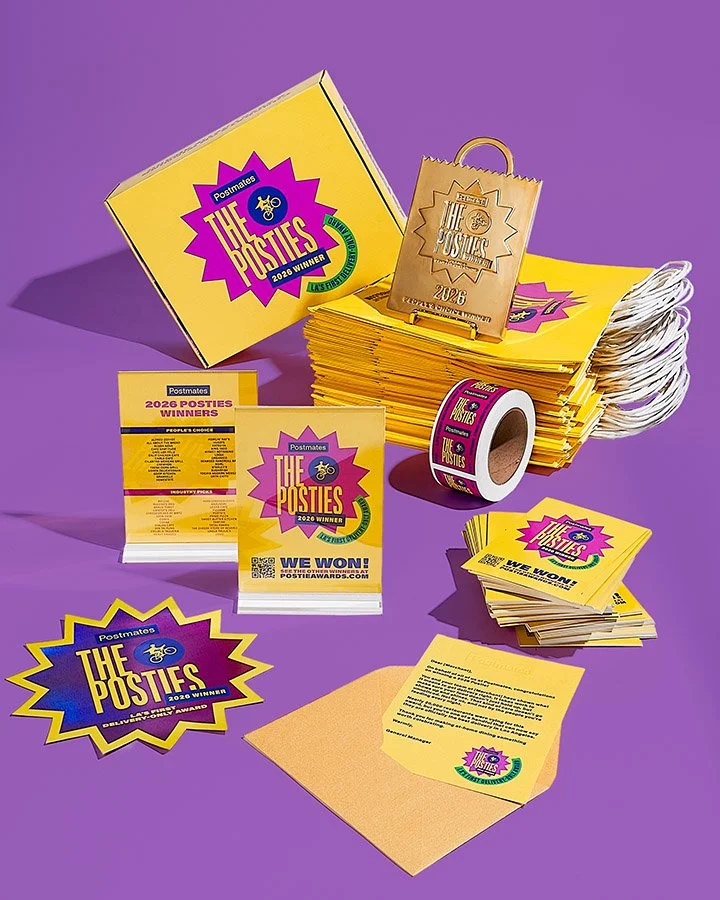 Complete Postmates The Posties award kit featuring custom packaging, printed collateral, and presentation pieces
