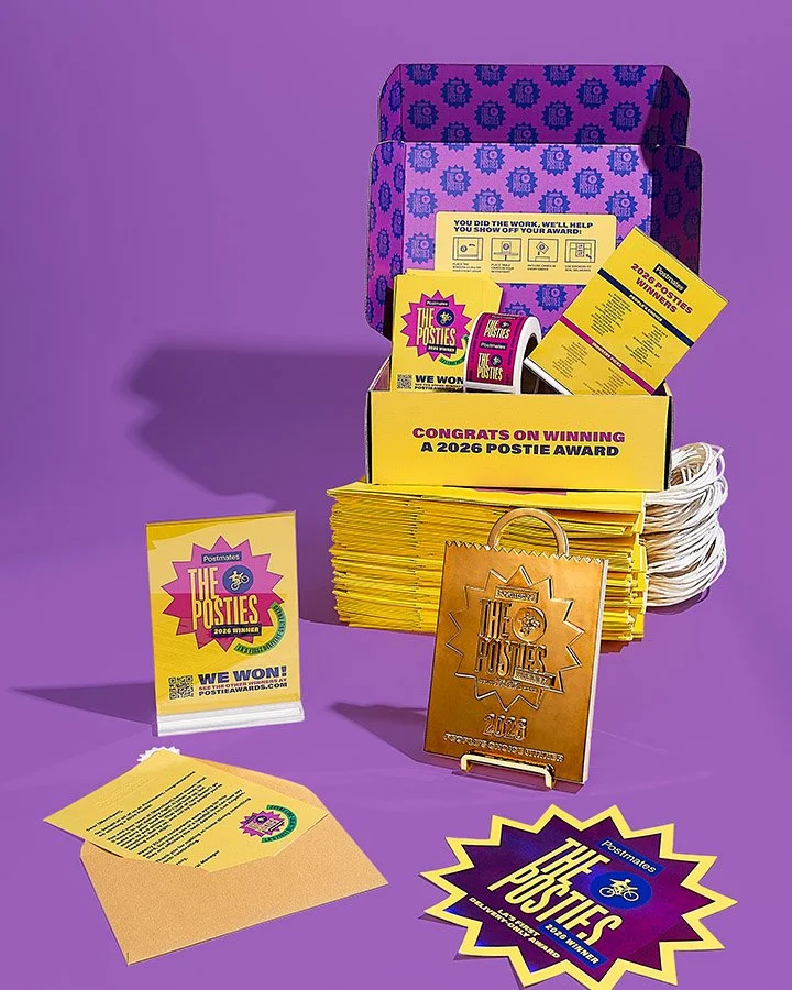 Custom Postmates award kit packaging with presentation box and printed inserts by Bigger Dot
