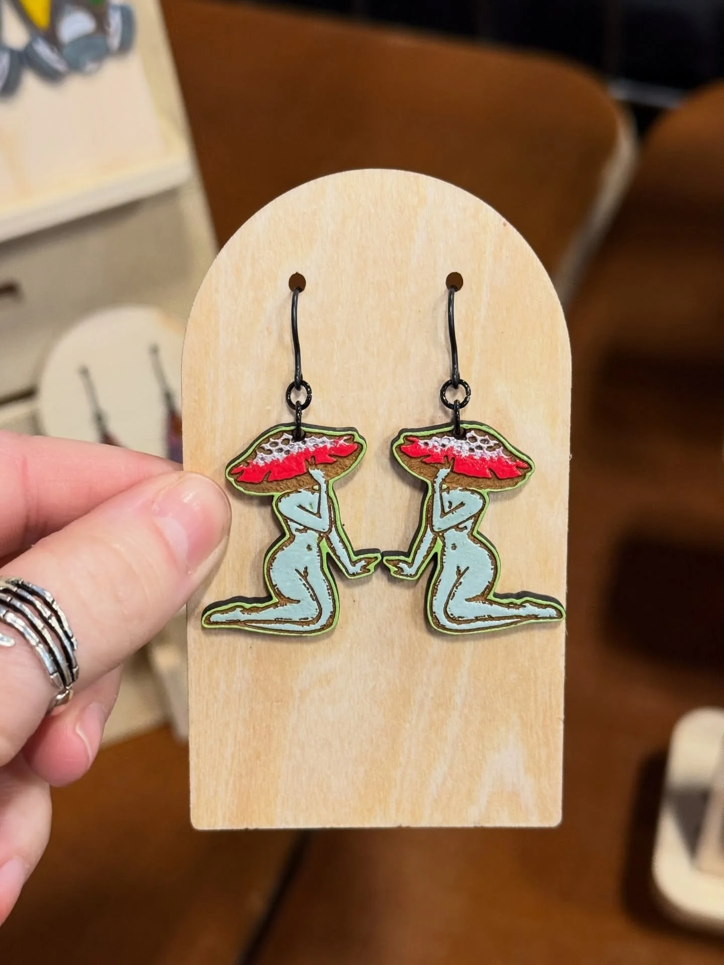 Swipe ➡️➡️➡️ to see a tiny look at some of the many new designs making their debut at @worldodditiesexpo this weekend. #earrings #handpainted #lasercut #allergyfriendly #woodearrings
