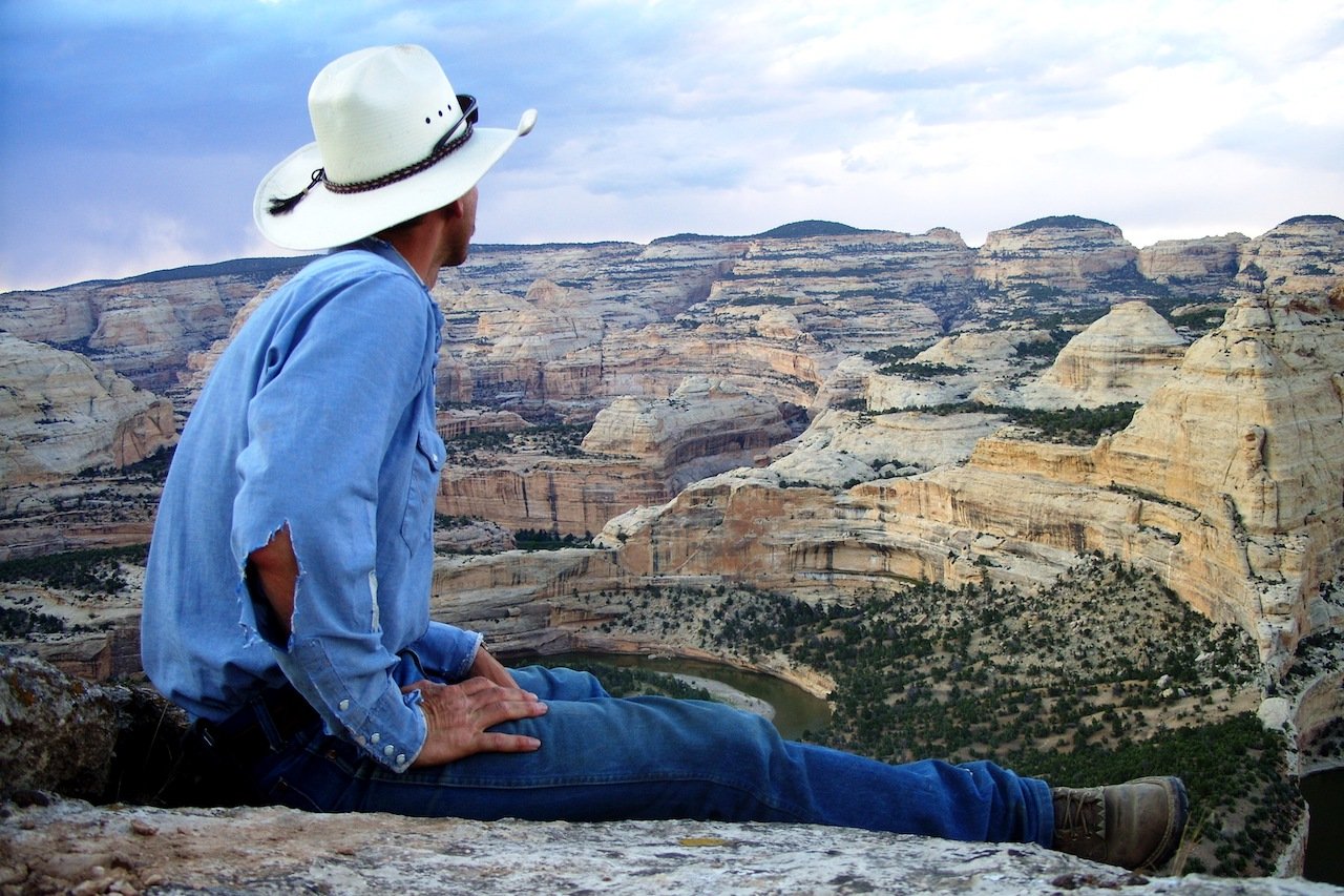 Matt Barnes looking over cliff in Southwestern Colorado